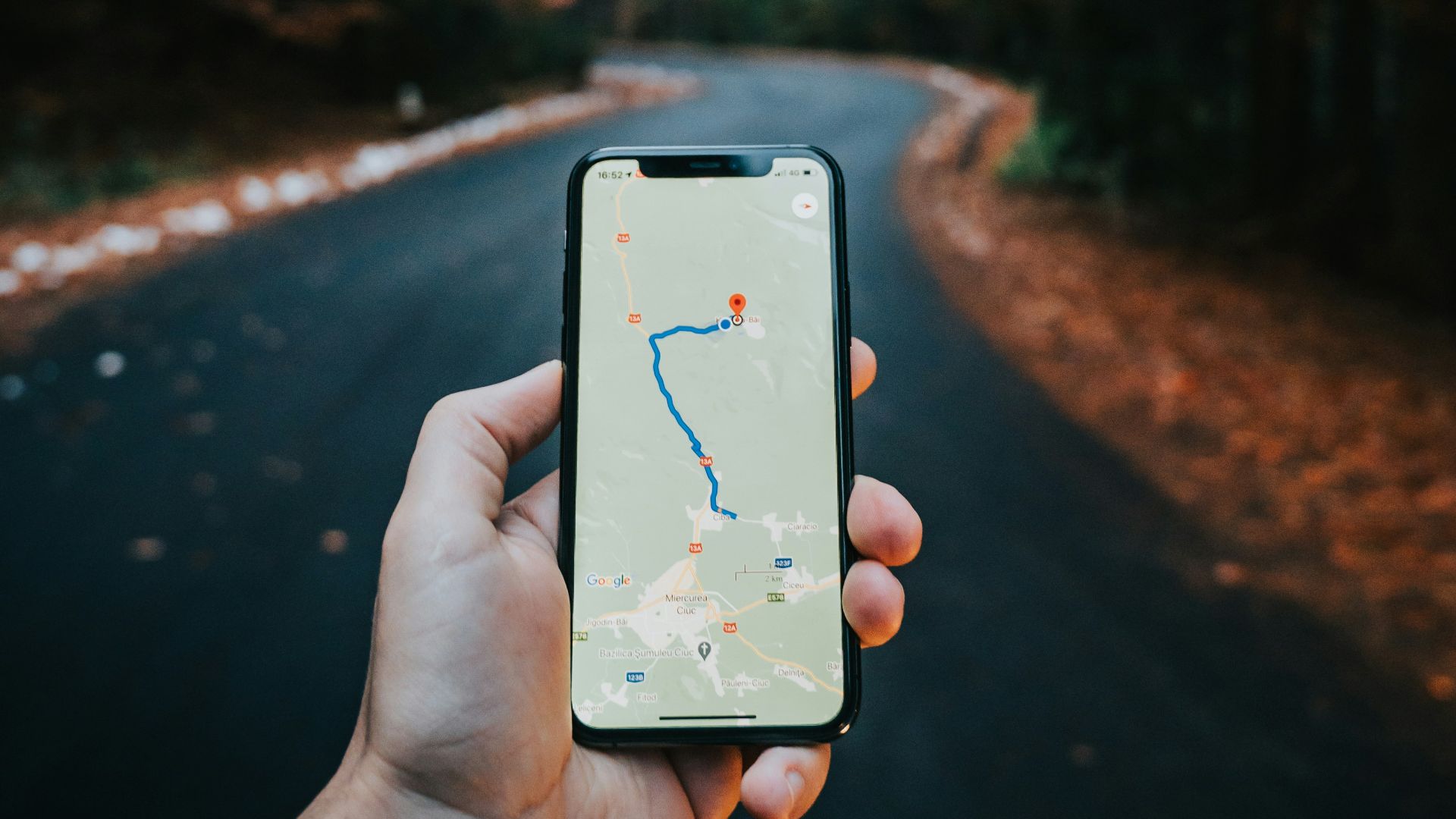 person holding white iphone 5 c