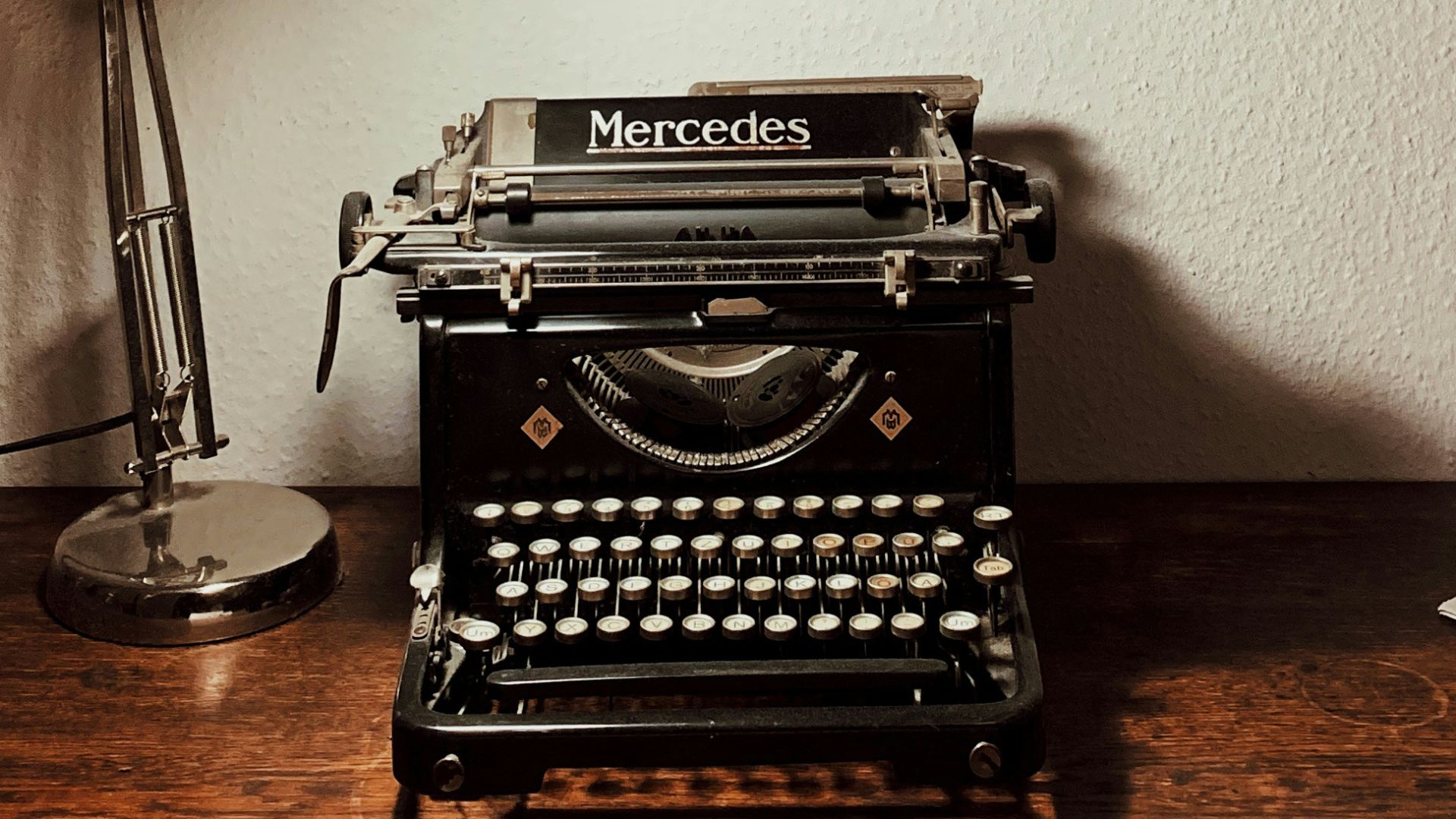 turned-on desk lamp near calculator