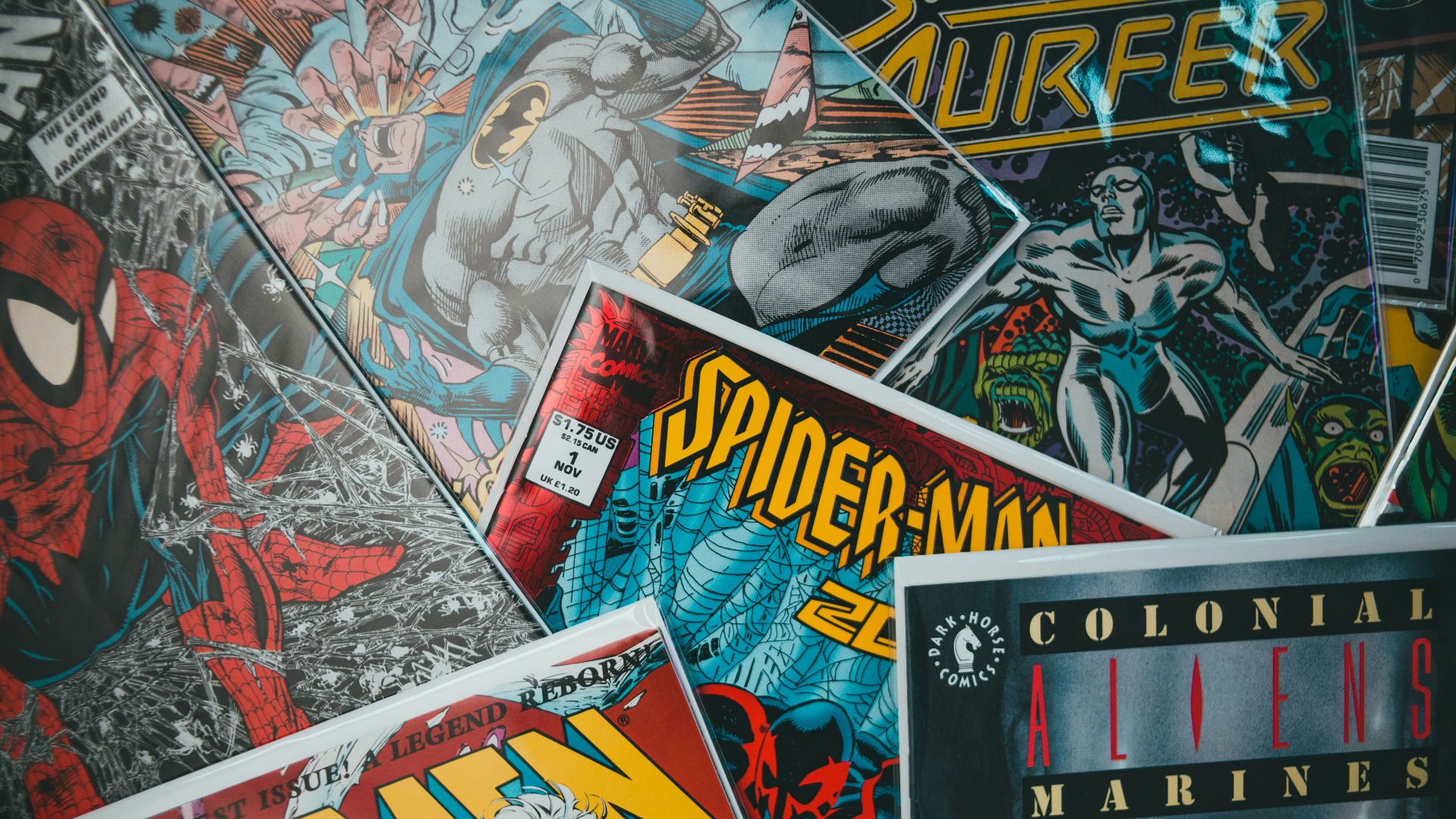 a pile of comics sitting next to each other