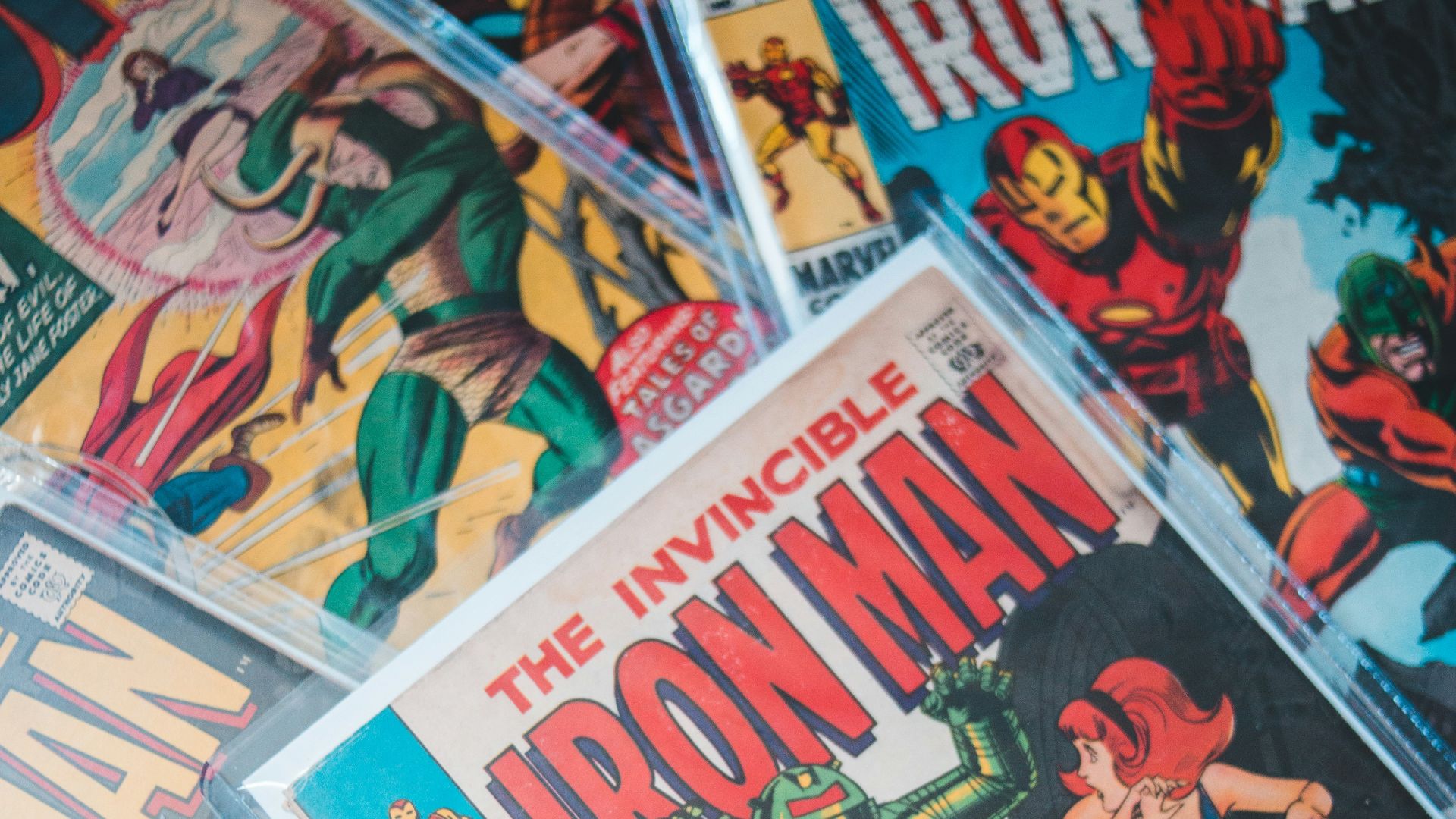 a pile of comics sitting on top of a table