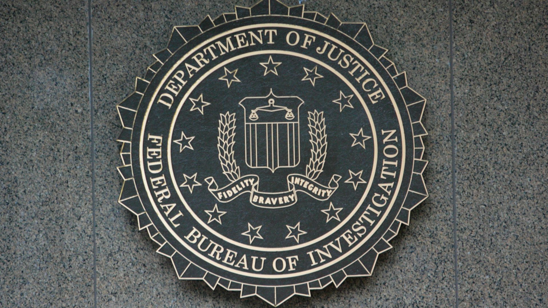 the seal of the department of justice on a wall