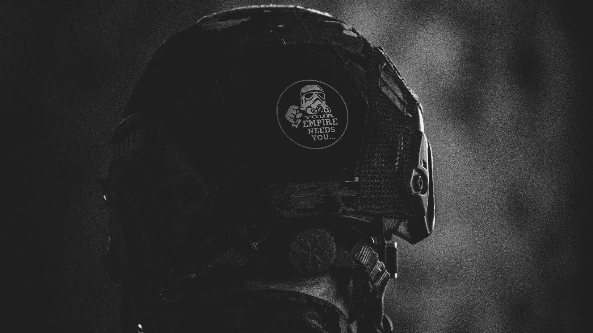 grayscale photo of man wearing helmet