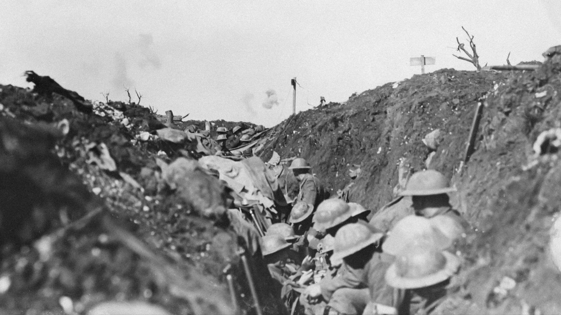 a black and white photo of soldiers in a trench