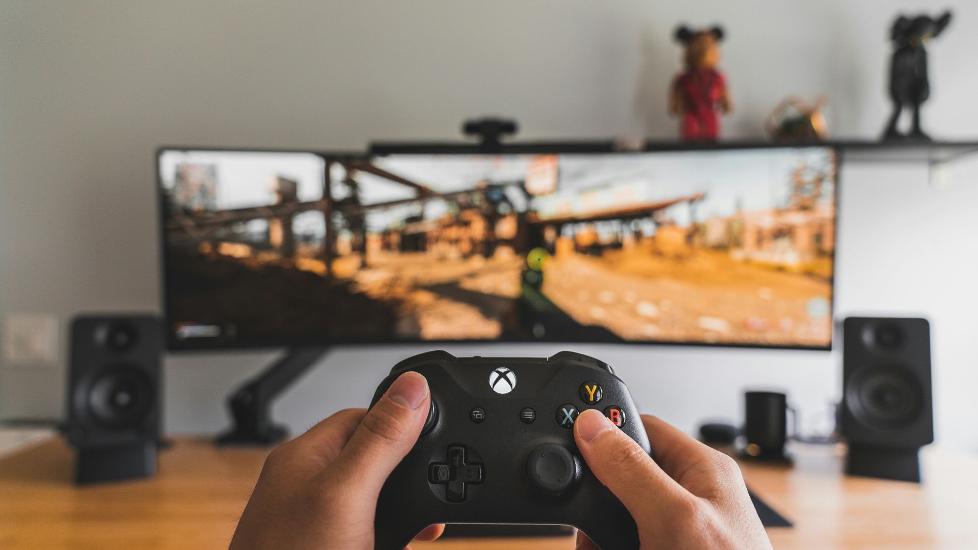 person holding black game controller