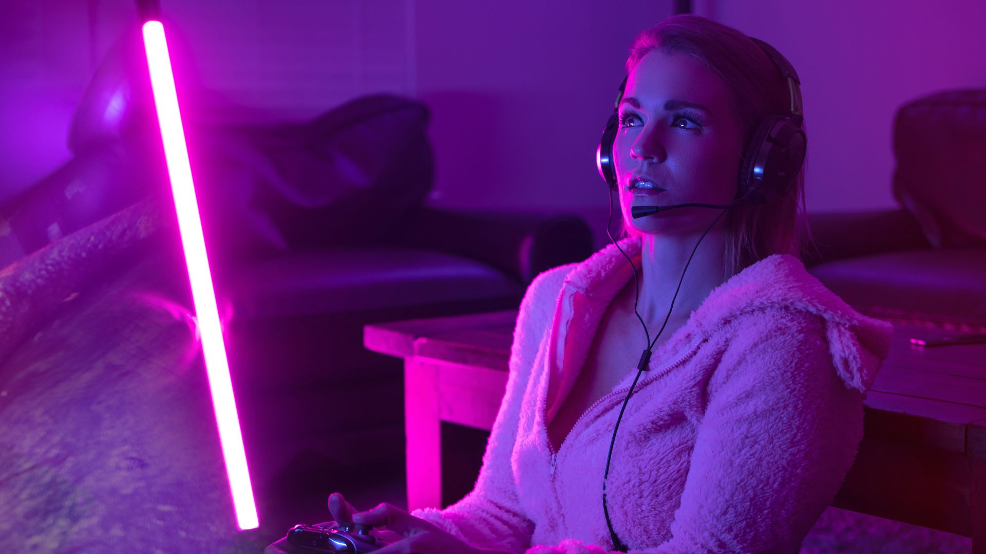woman in white robe sitting on couch