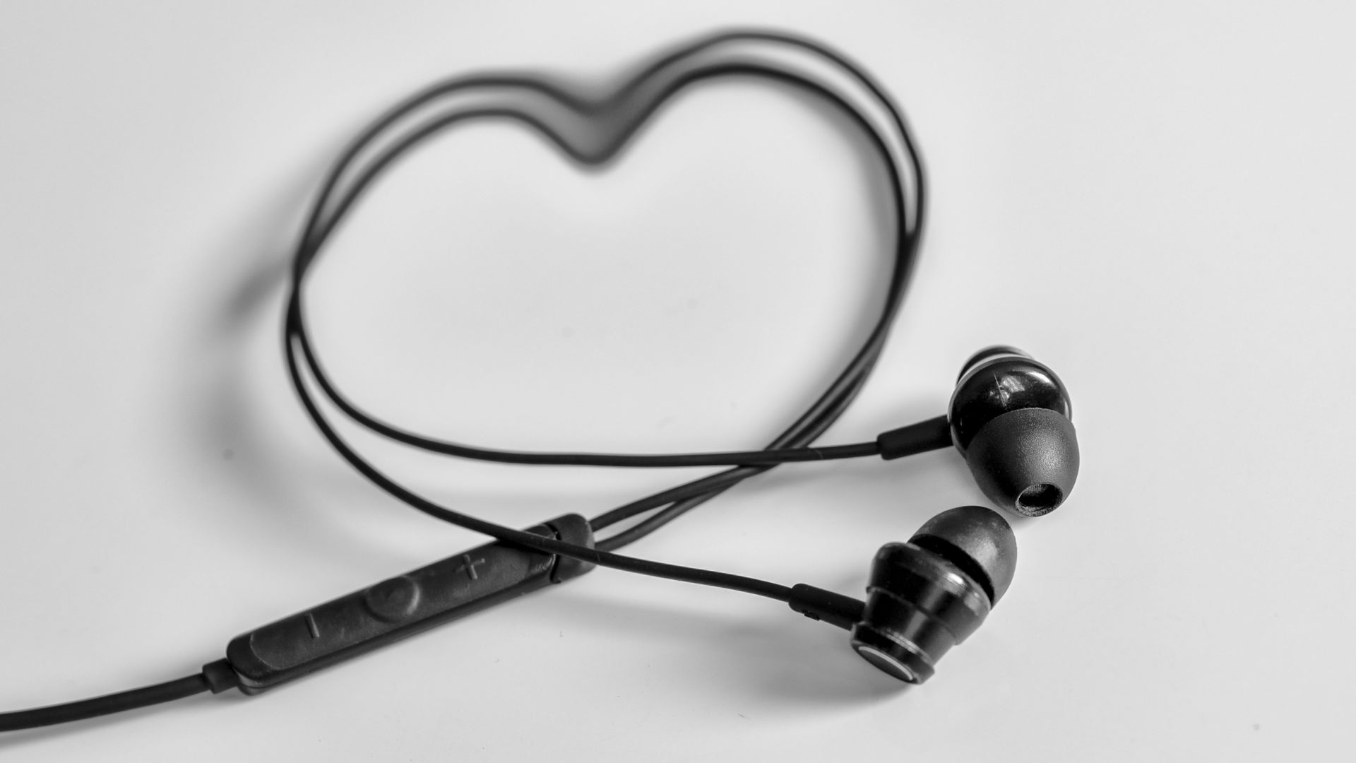 a pair of ear buds sitting on top of a table