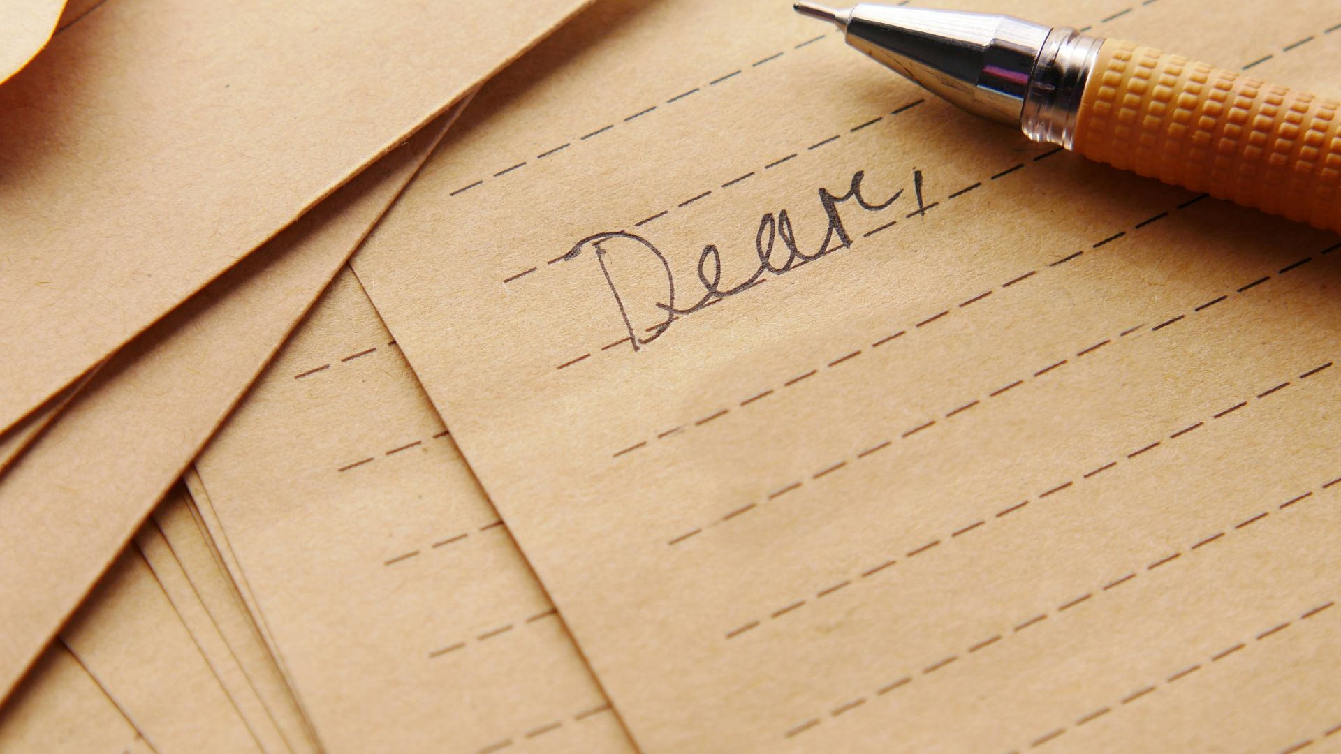 a pen sitting on top of a piece of paper