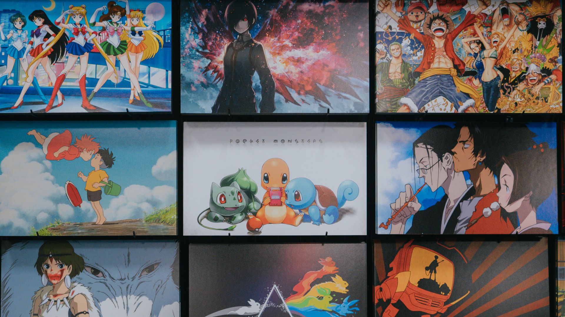 anime character collage photo on black wooden shelf