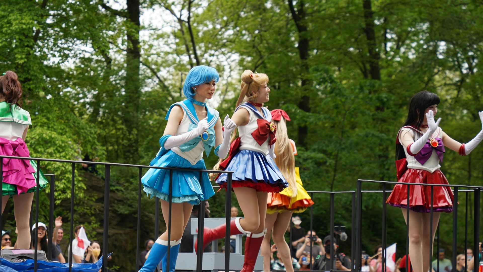 a group of people that are standing on a stage