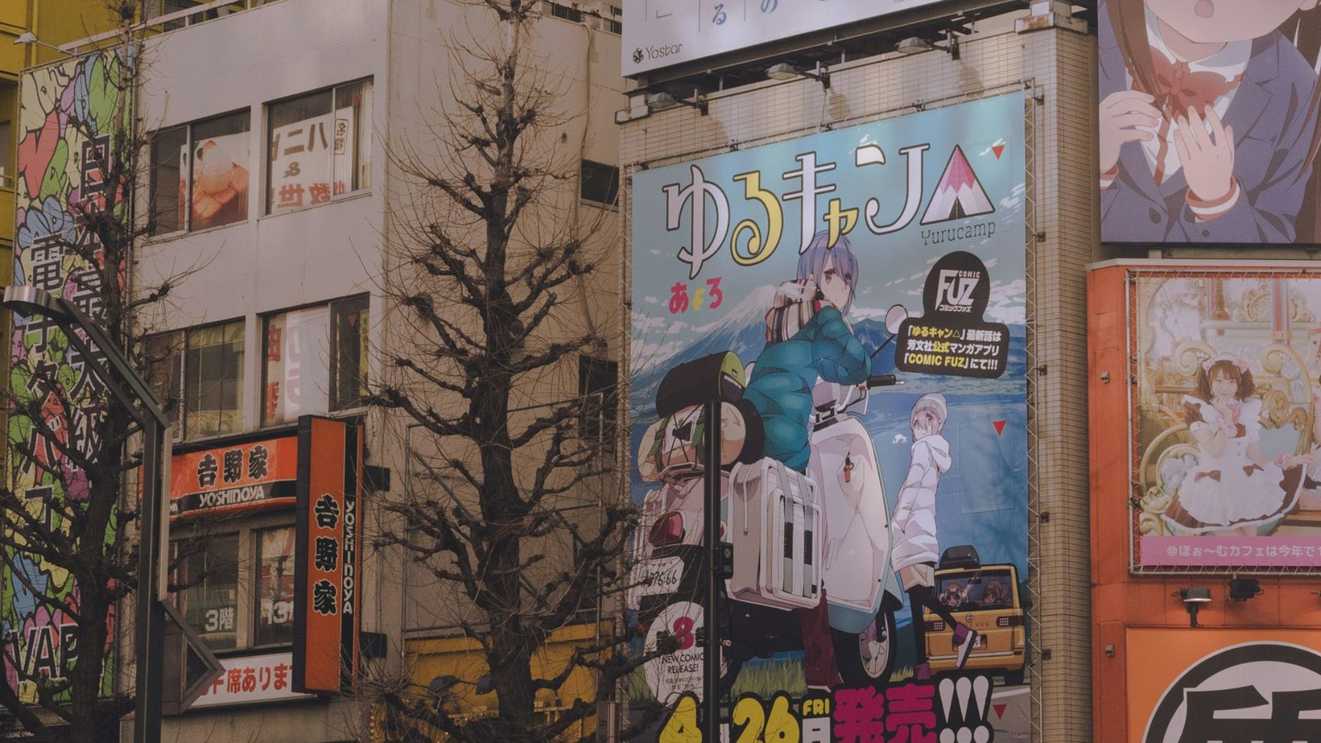 white and black cars parked beside brown building during daytime