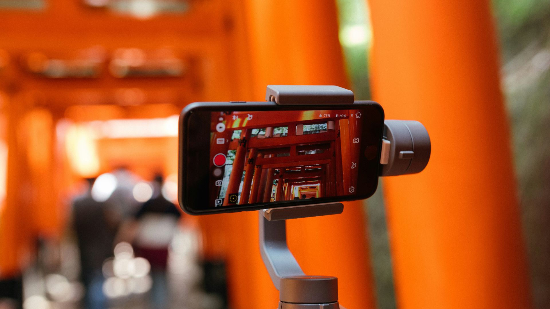 person taking picture of temple