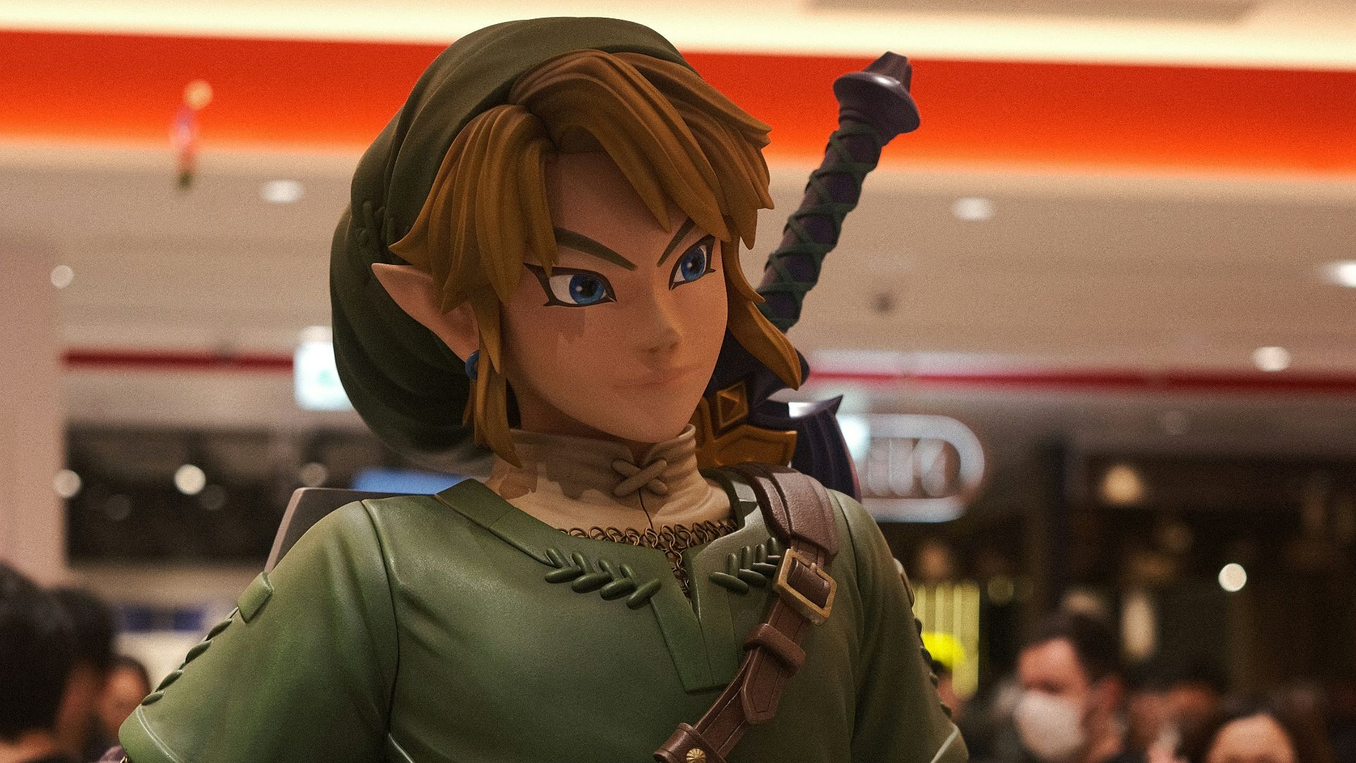 a statue of a woman in a green outfit