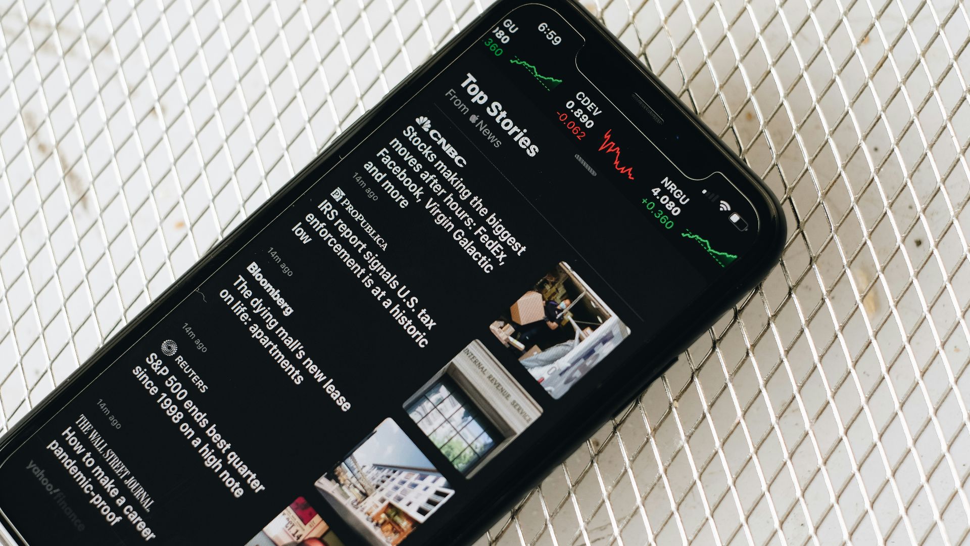 black samsung android smartphone on white textile