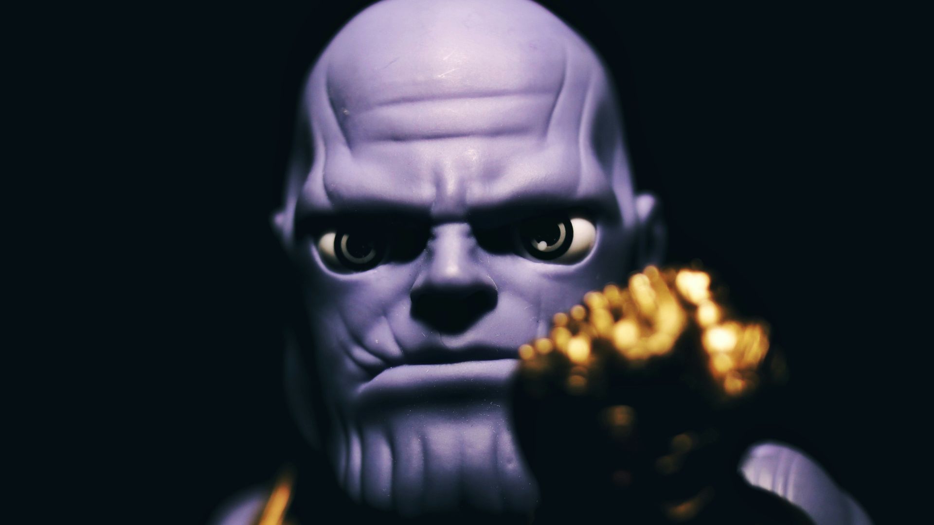 black and gold mask with black background