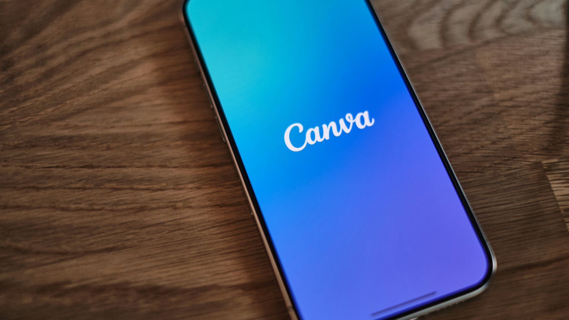 A cell phone sitting on top of a wooden table