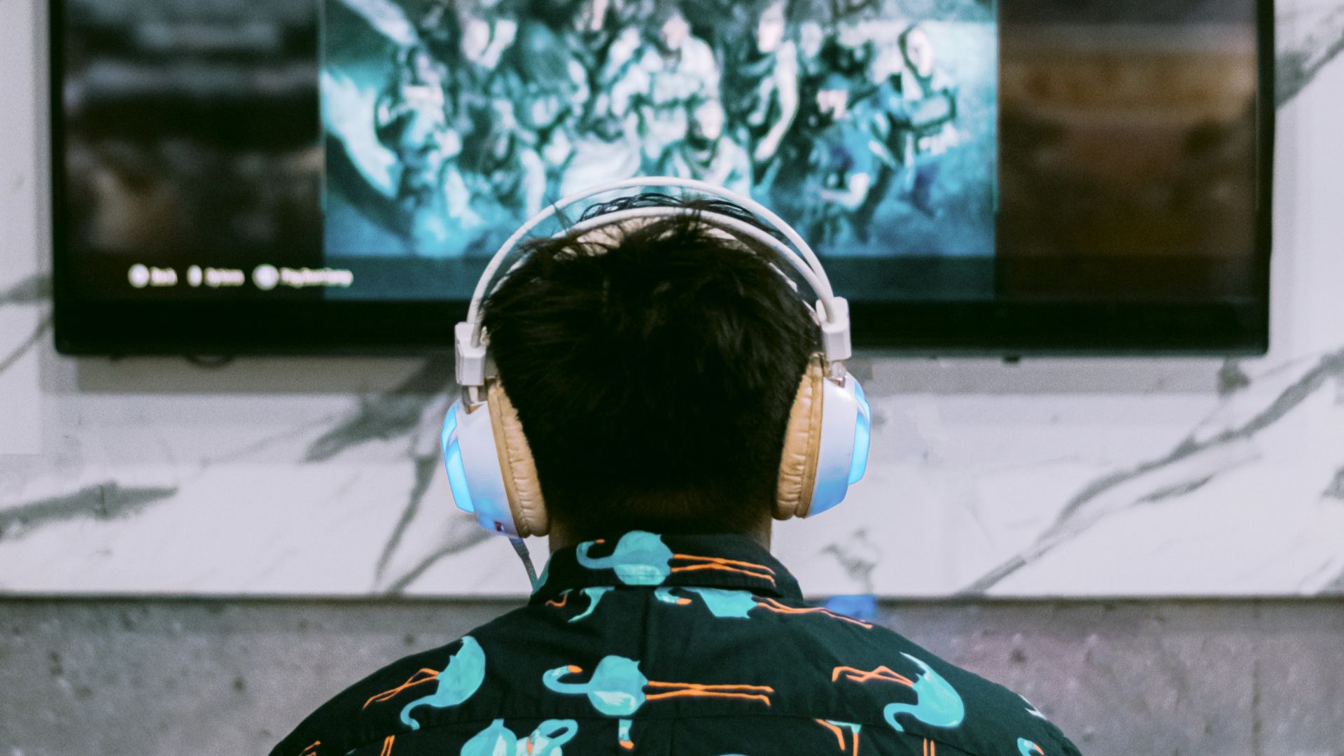 woman in black and white floral shirt standing in front of black and white wall
