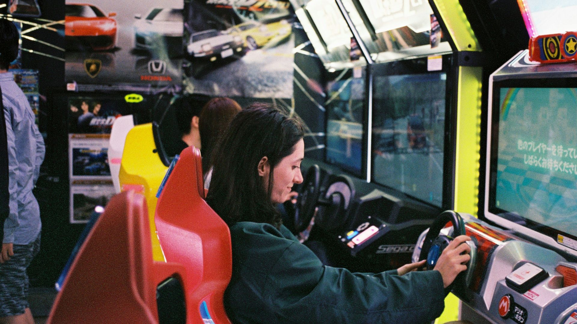 woman driving arcade machine