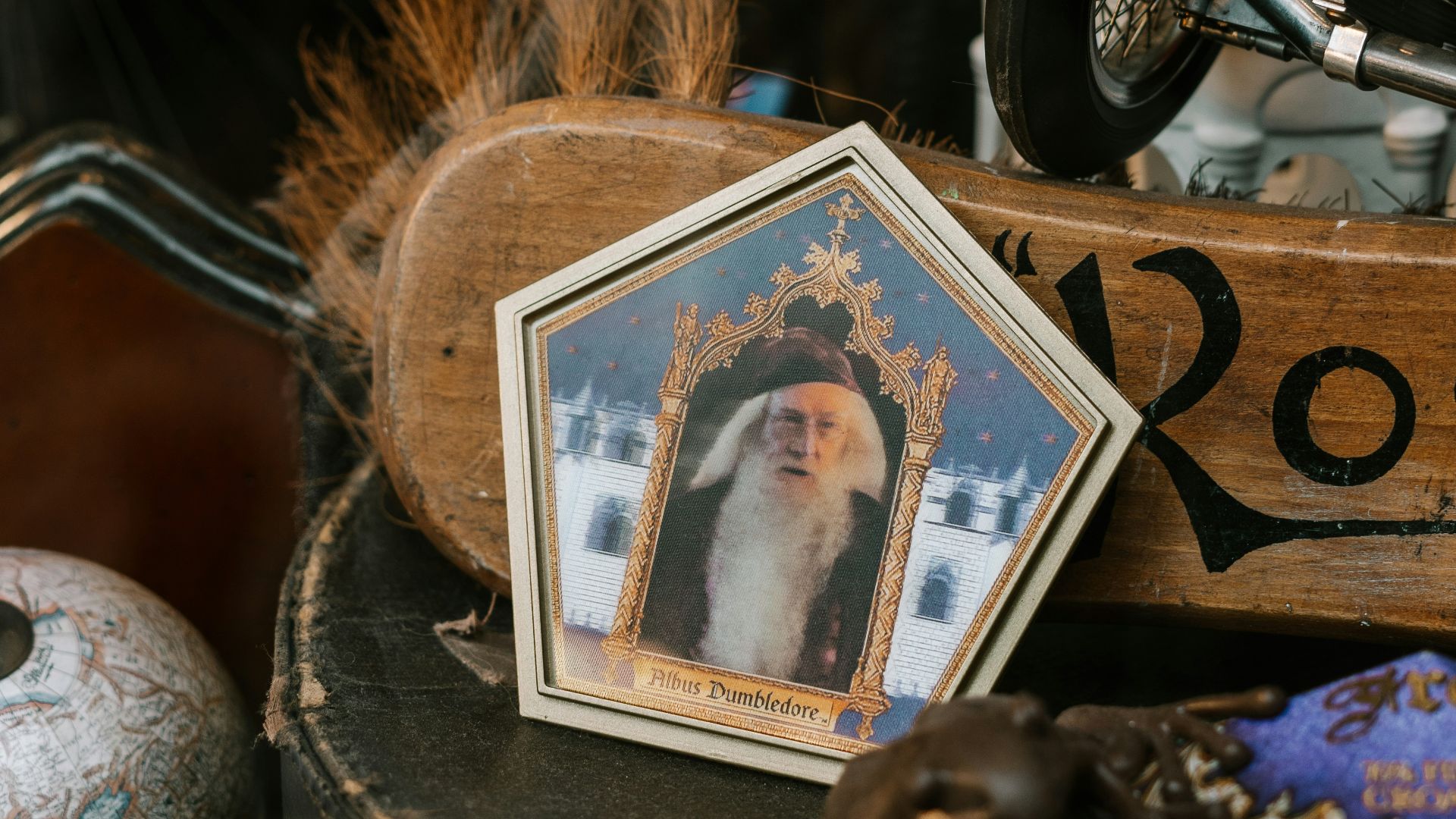 black and silver dumbbell beside brown wooden picture frame