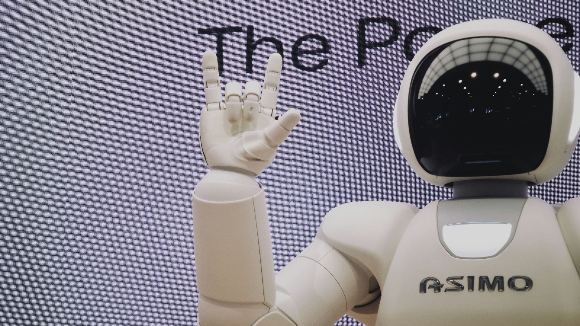Asimo robot doing handsign