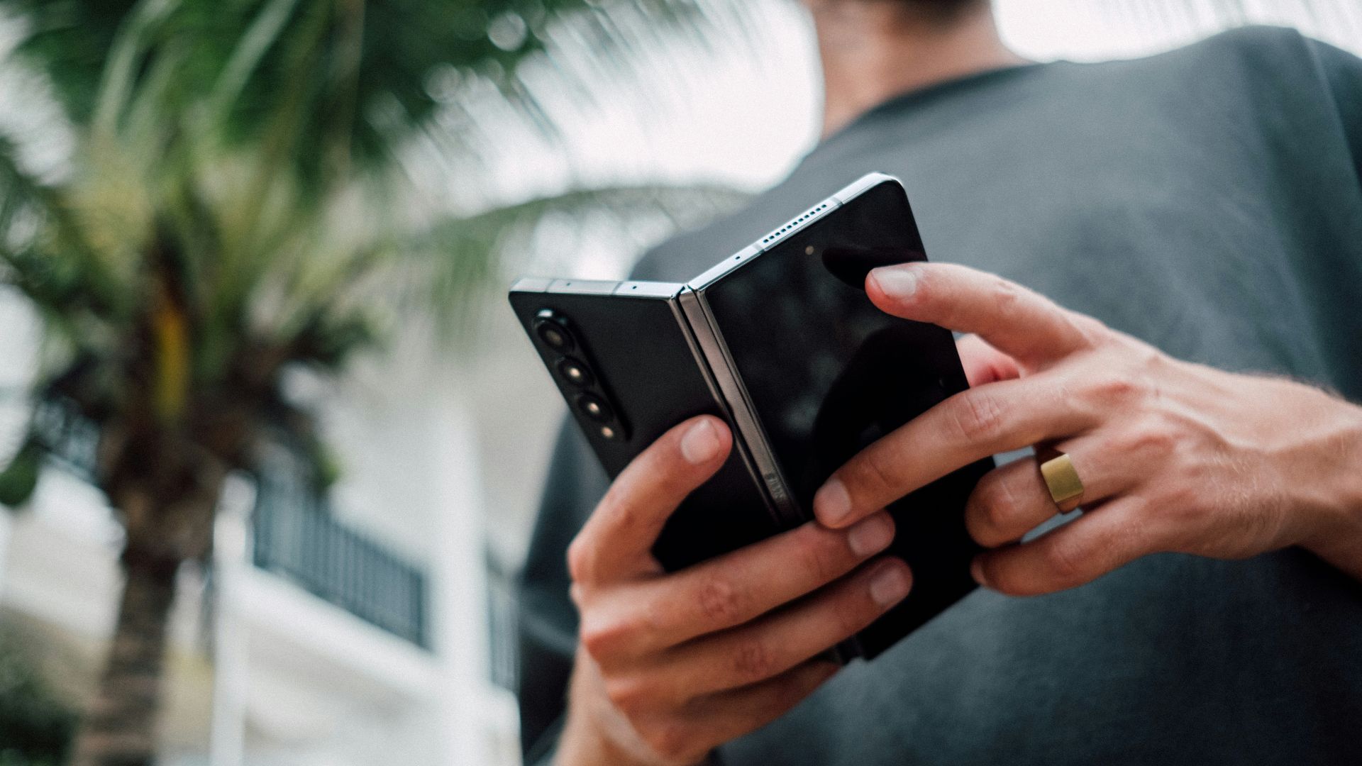 a man holding a smart phone in his hands