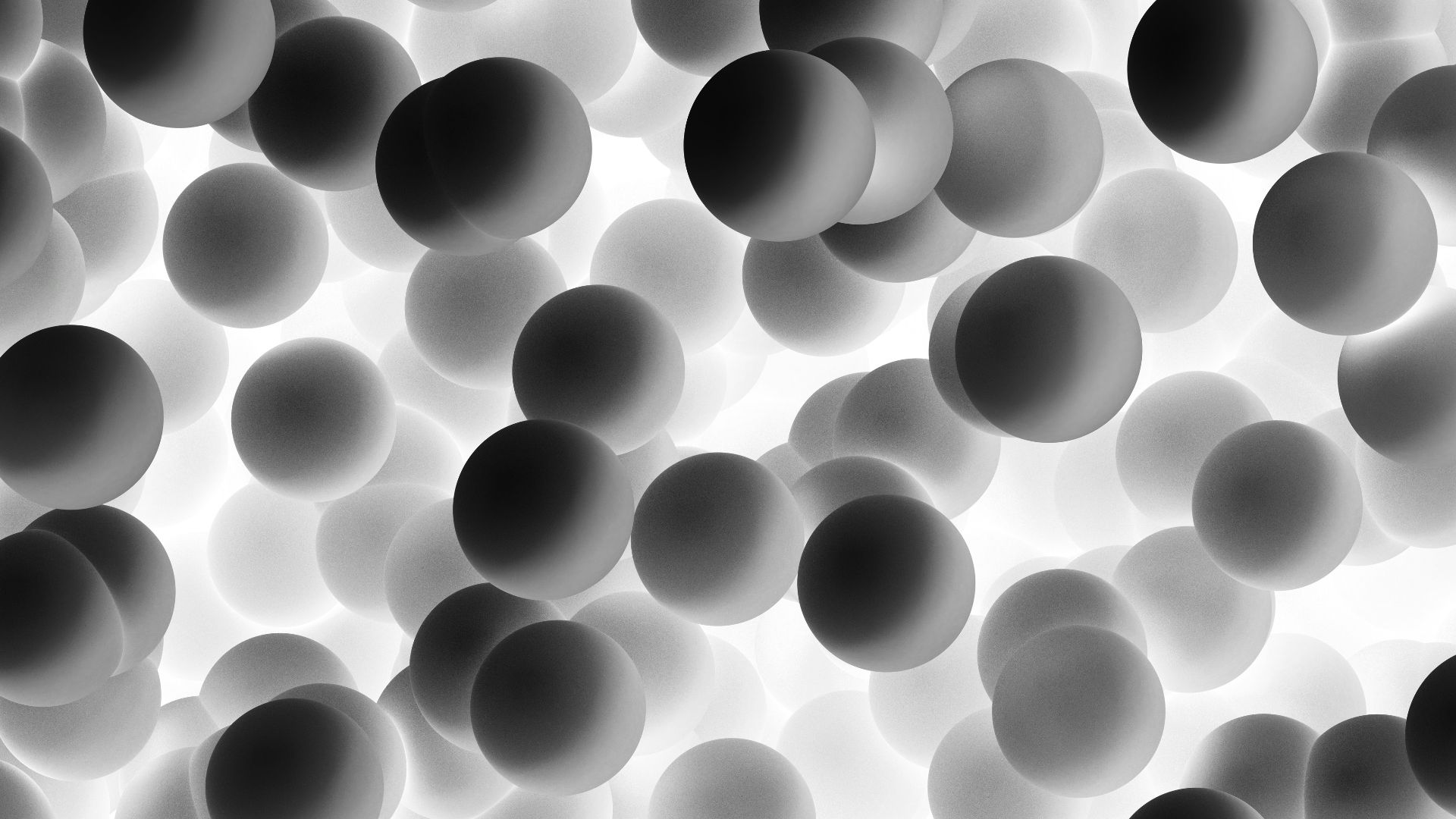a black and white photo of a bunch of balls