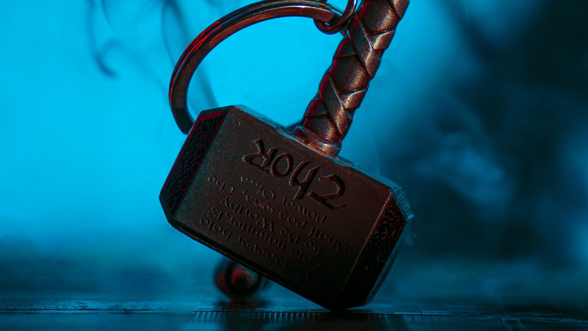 a metal hook with a sign on it