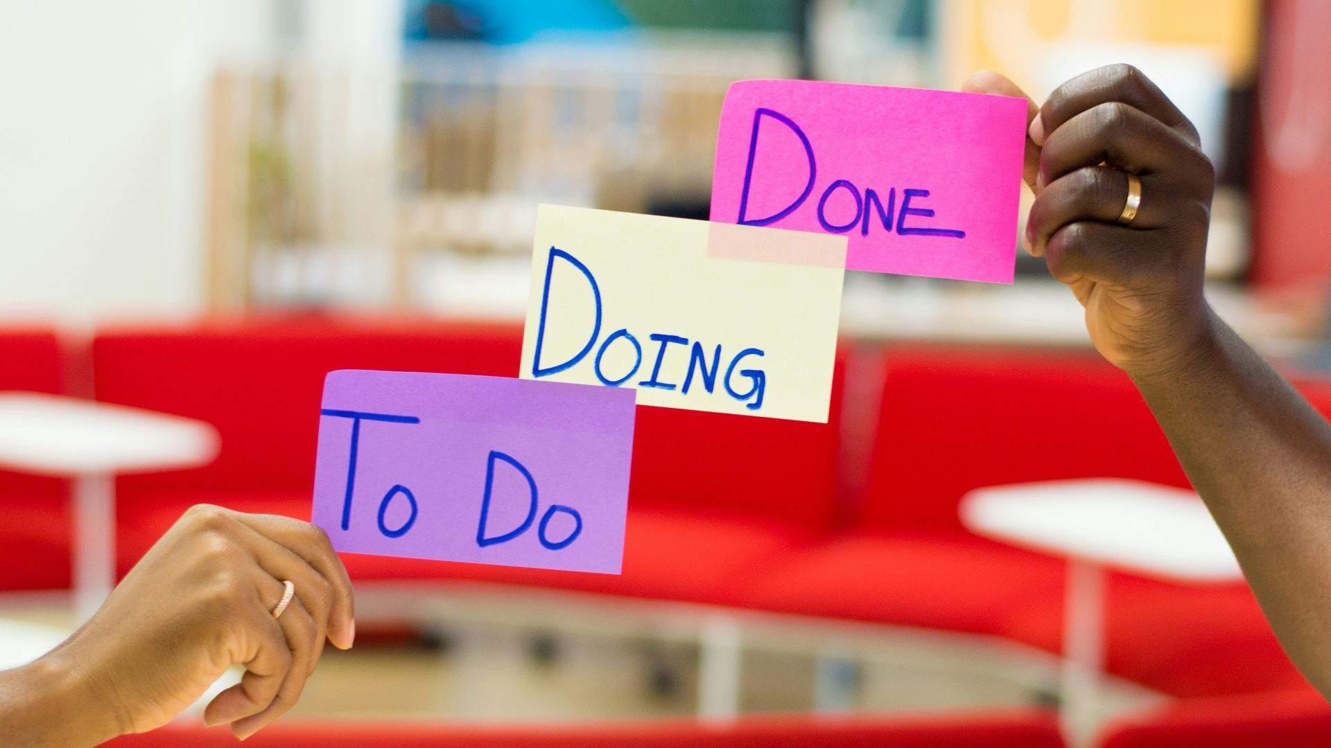 person holding purple and white card
