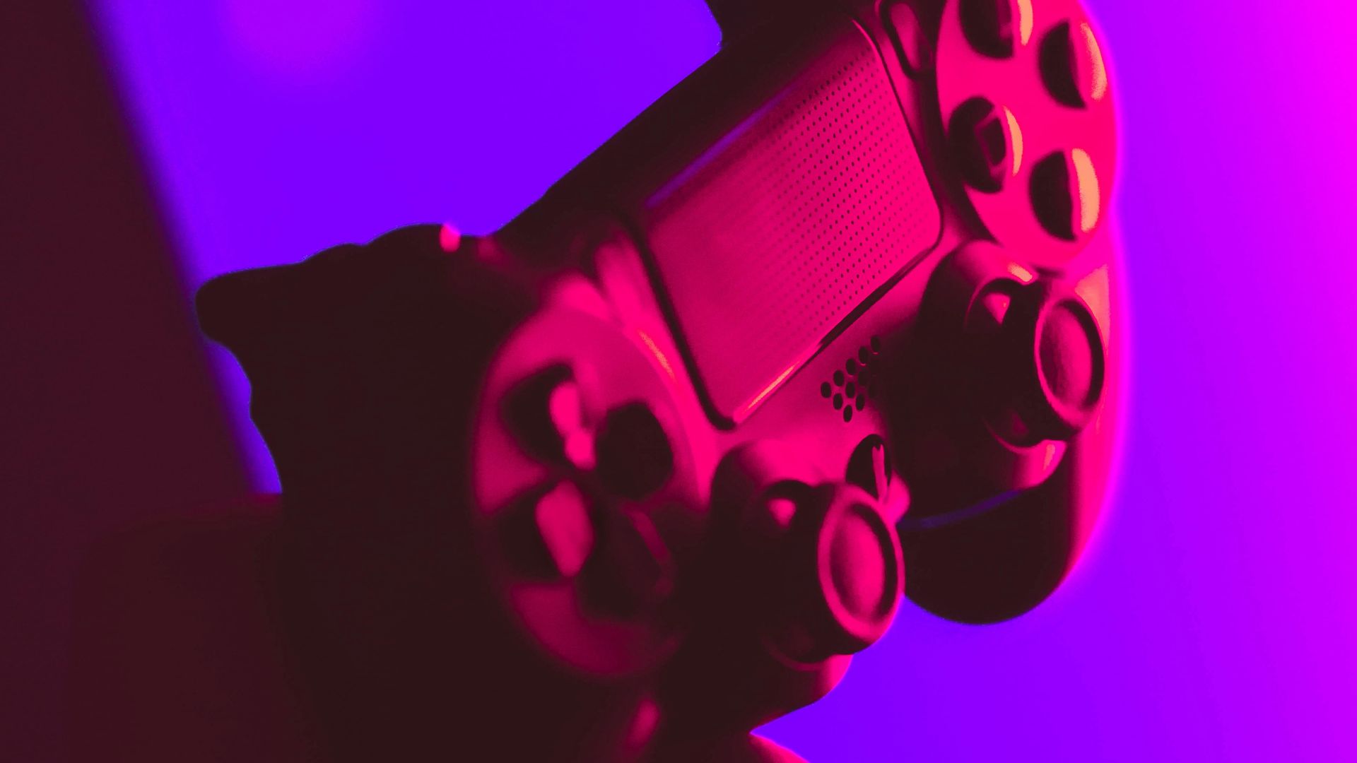 person holding black and gray game controller