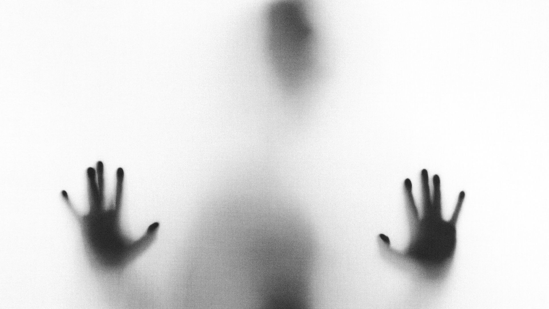 person behind fog glass