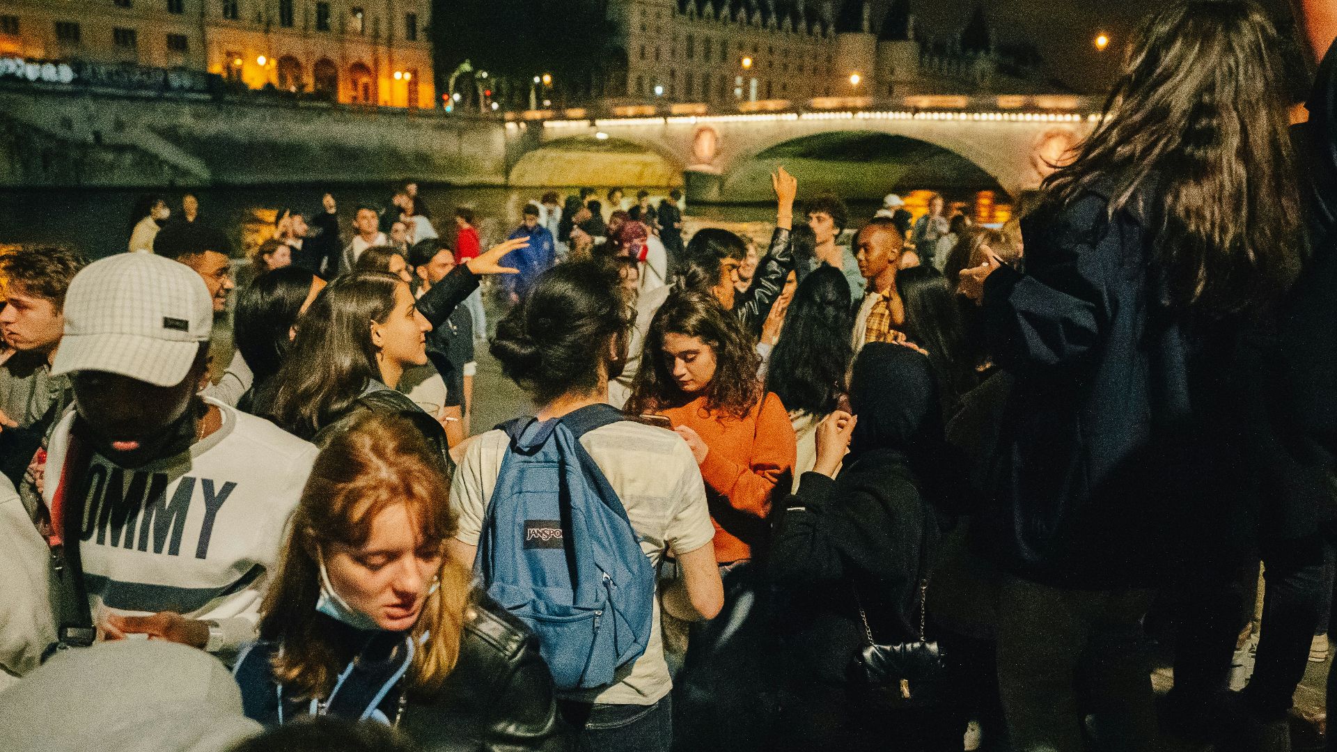 people standing on street during night time