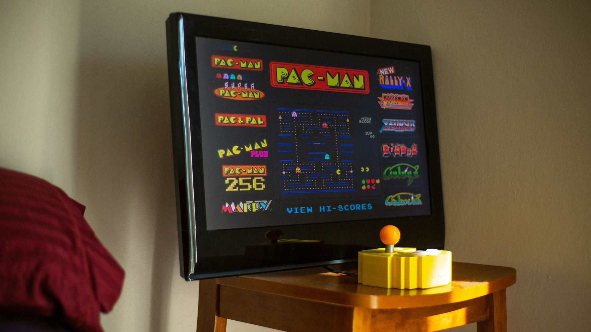 black flat screen tv on brown wooden table