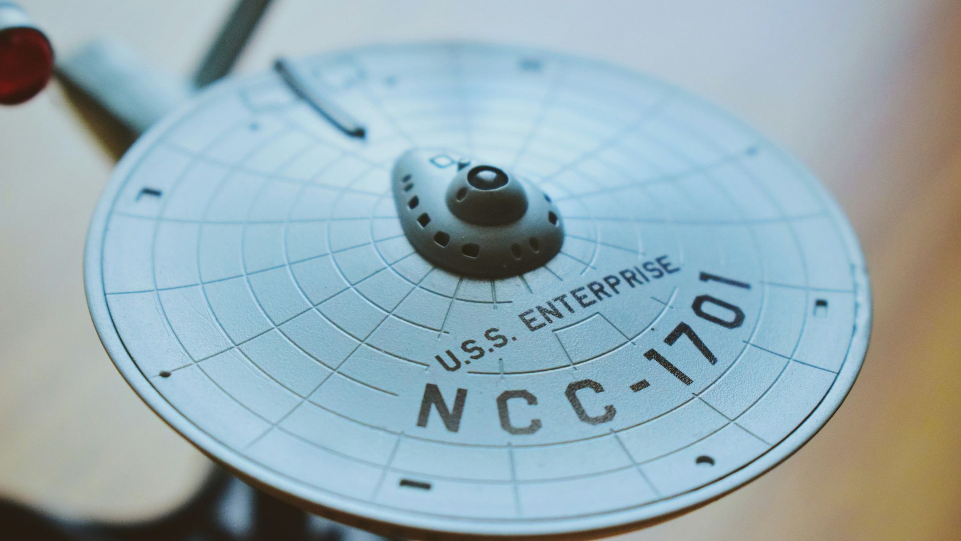 round gray USS Enterprise aircraft scale model