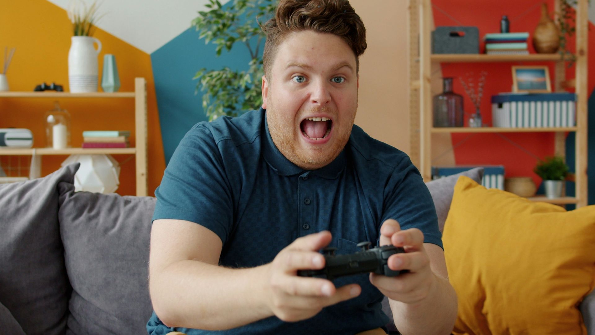 Man playing video games with excited expression