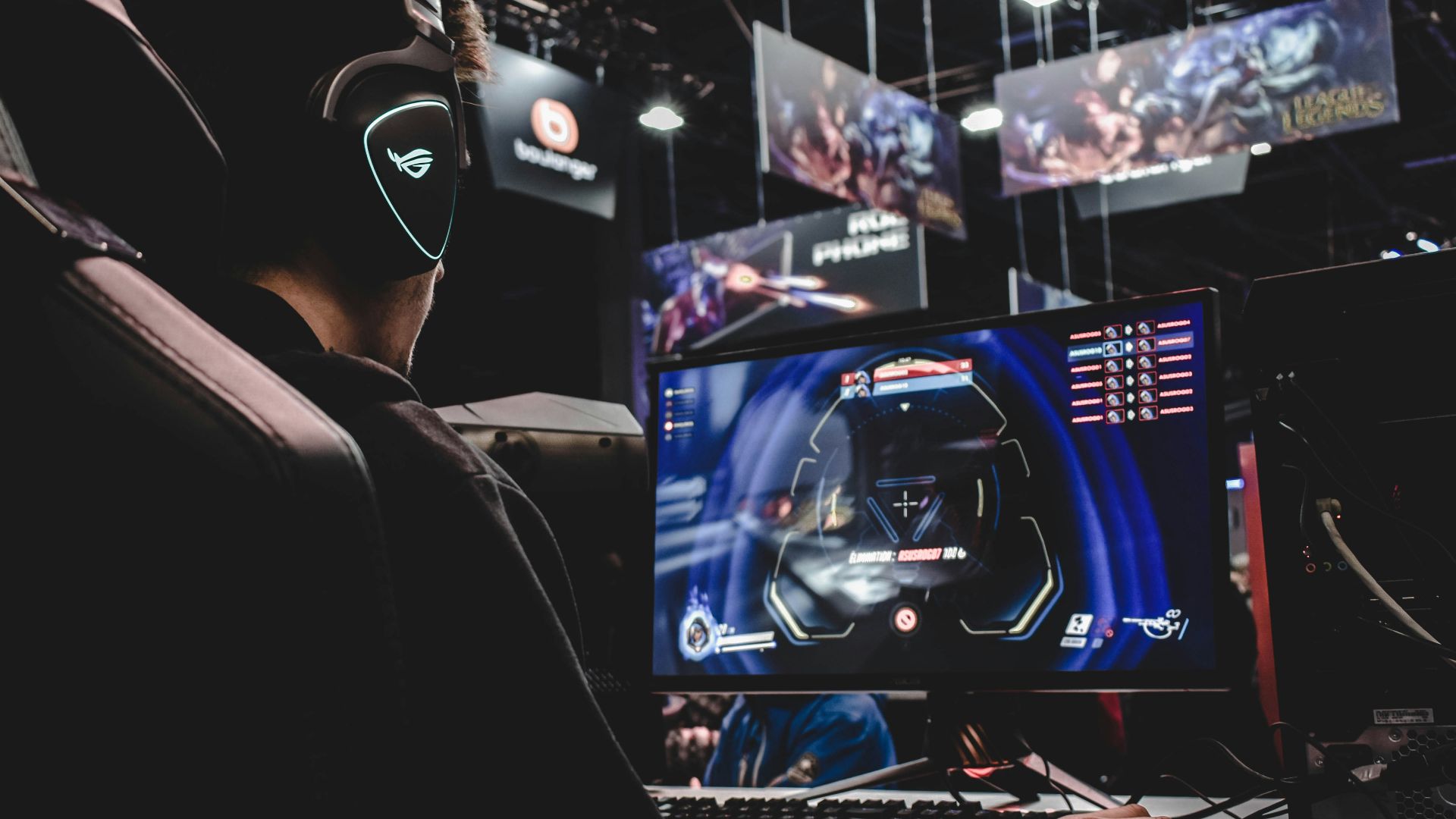 person sitting on gaming chair while playing video game