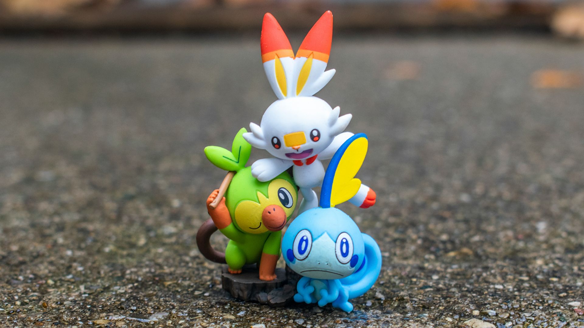 a group of pokemon figurines sitting on top of a rock