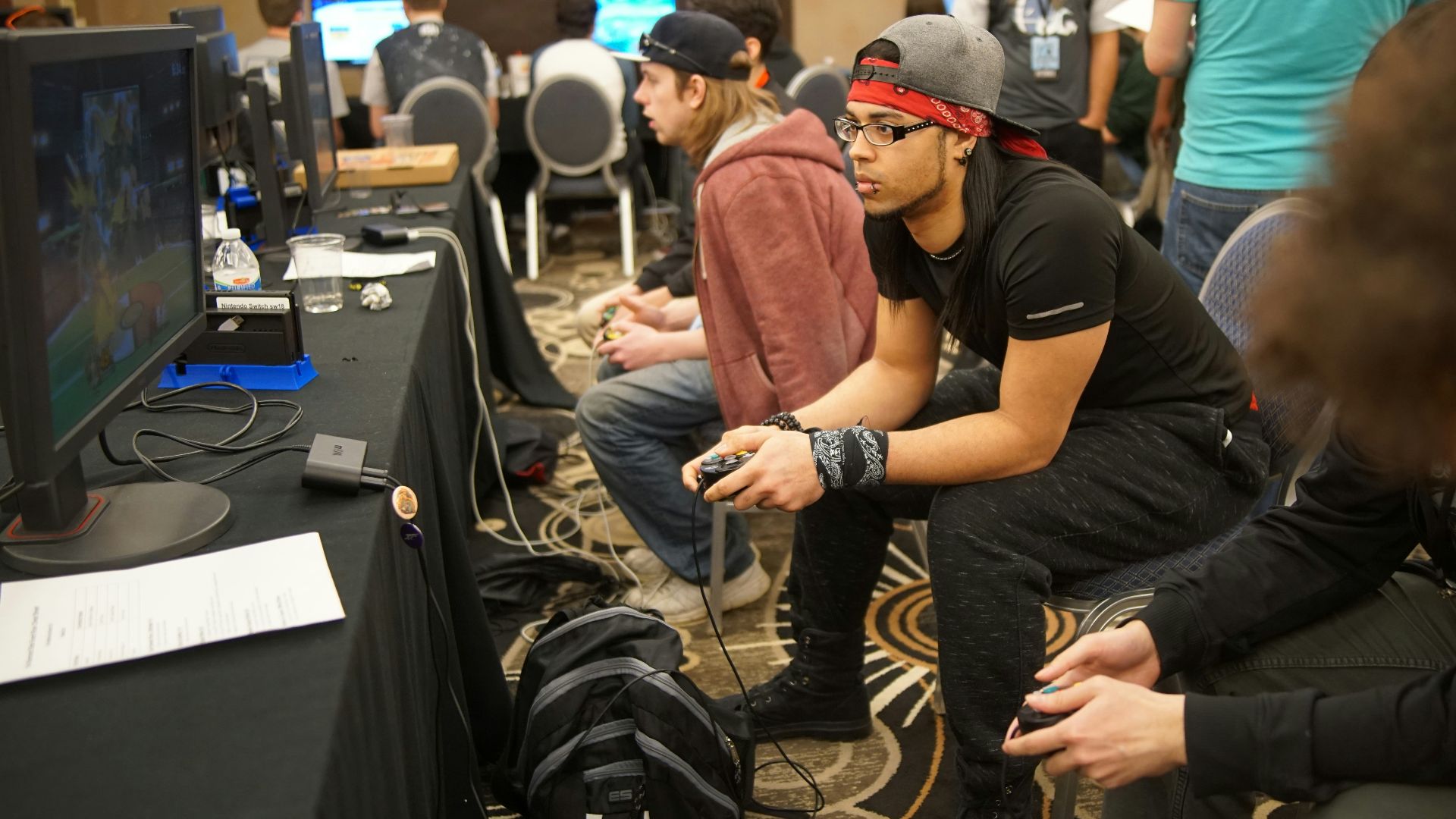 man sitting on chair playing games