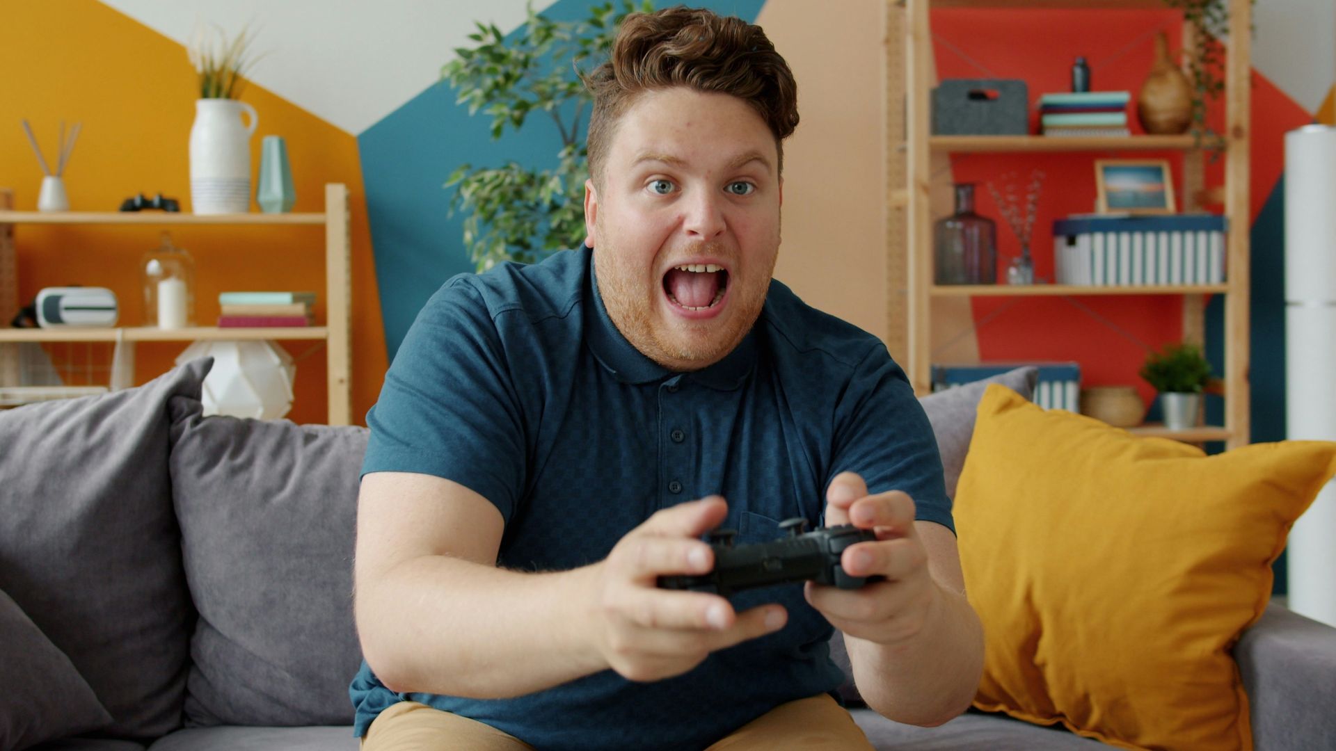 Man playing video games with excited expression