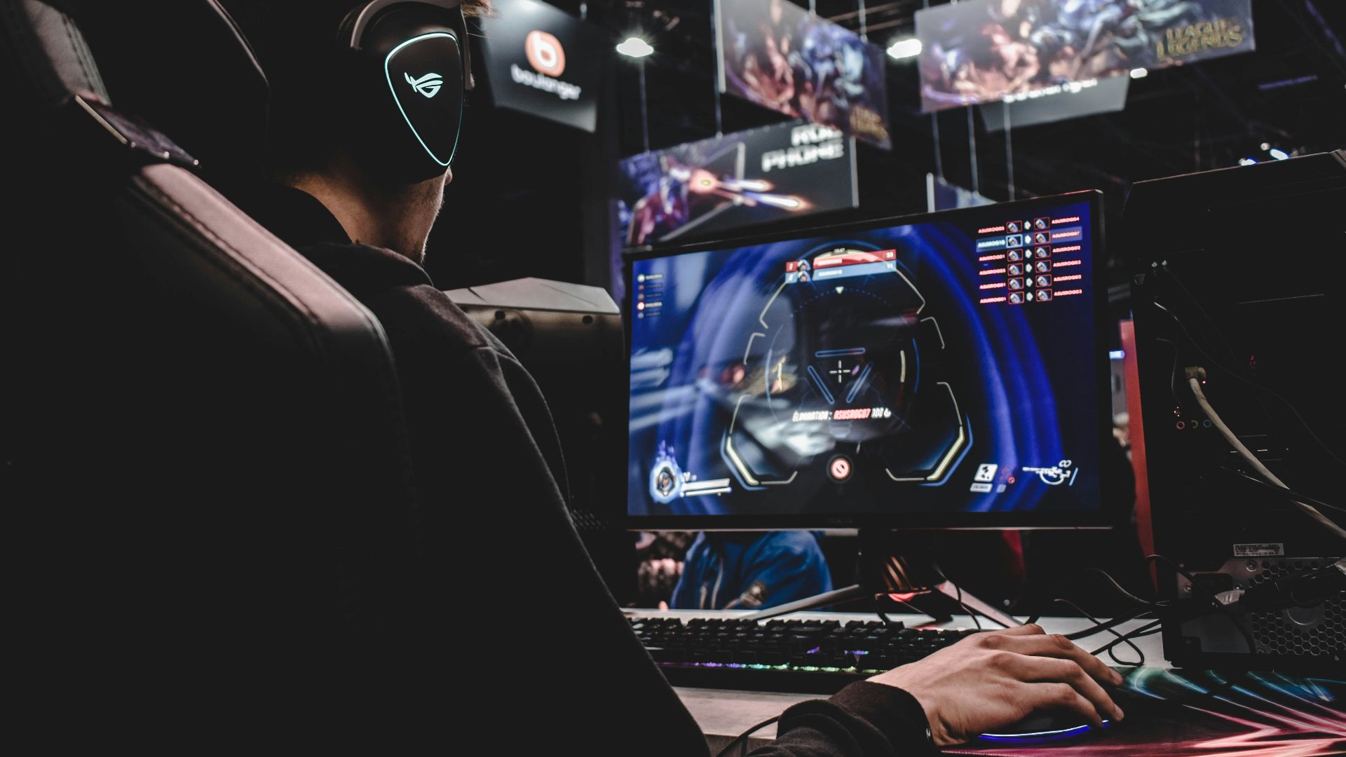 person sitting on gaming chair while playing video game