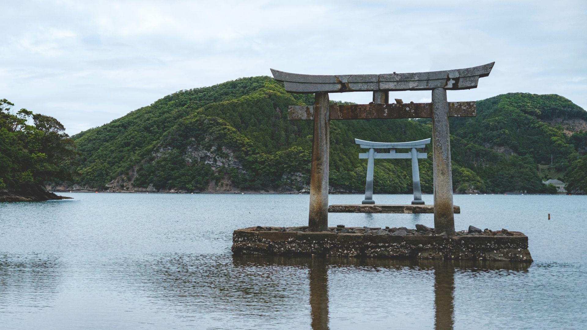 a large body of water with a wooden structure in the middle of it