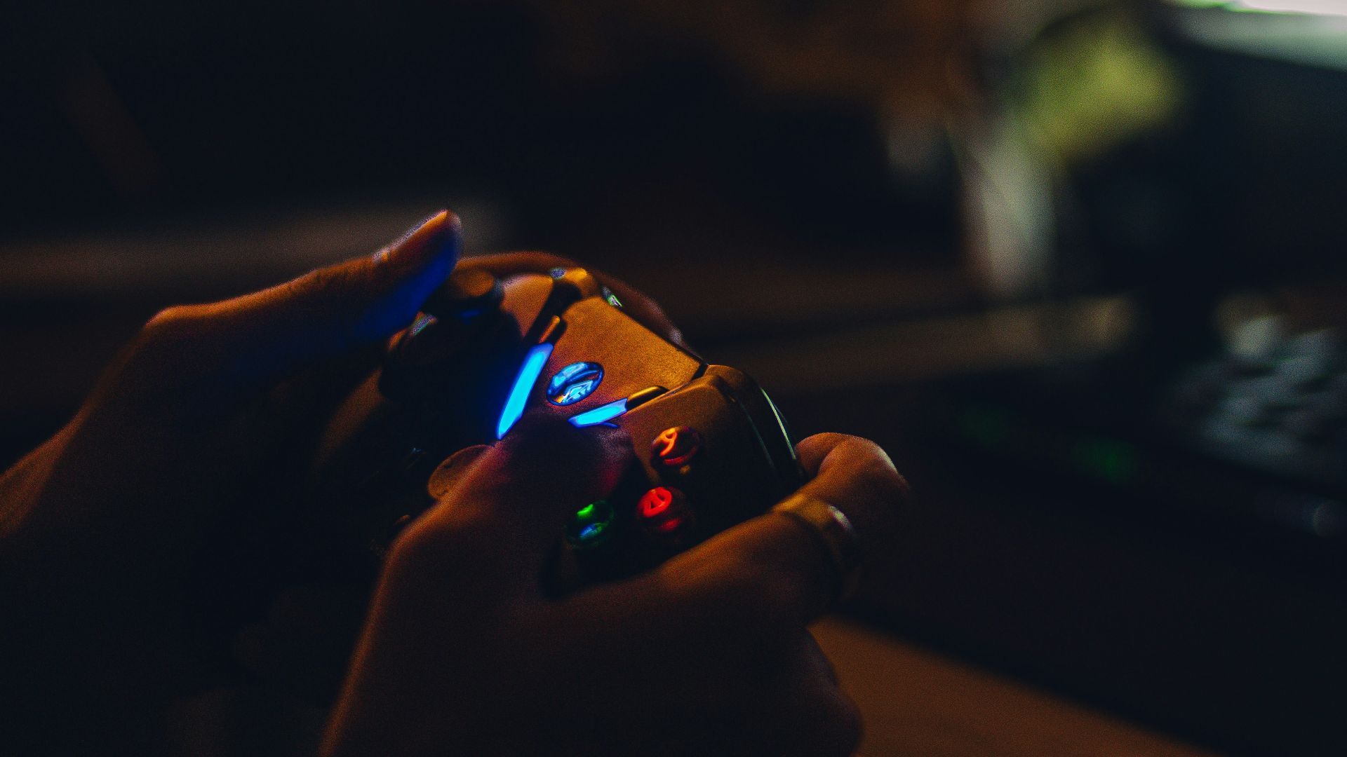 a person holding a game controller in their hand
