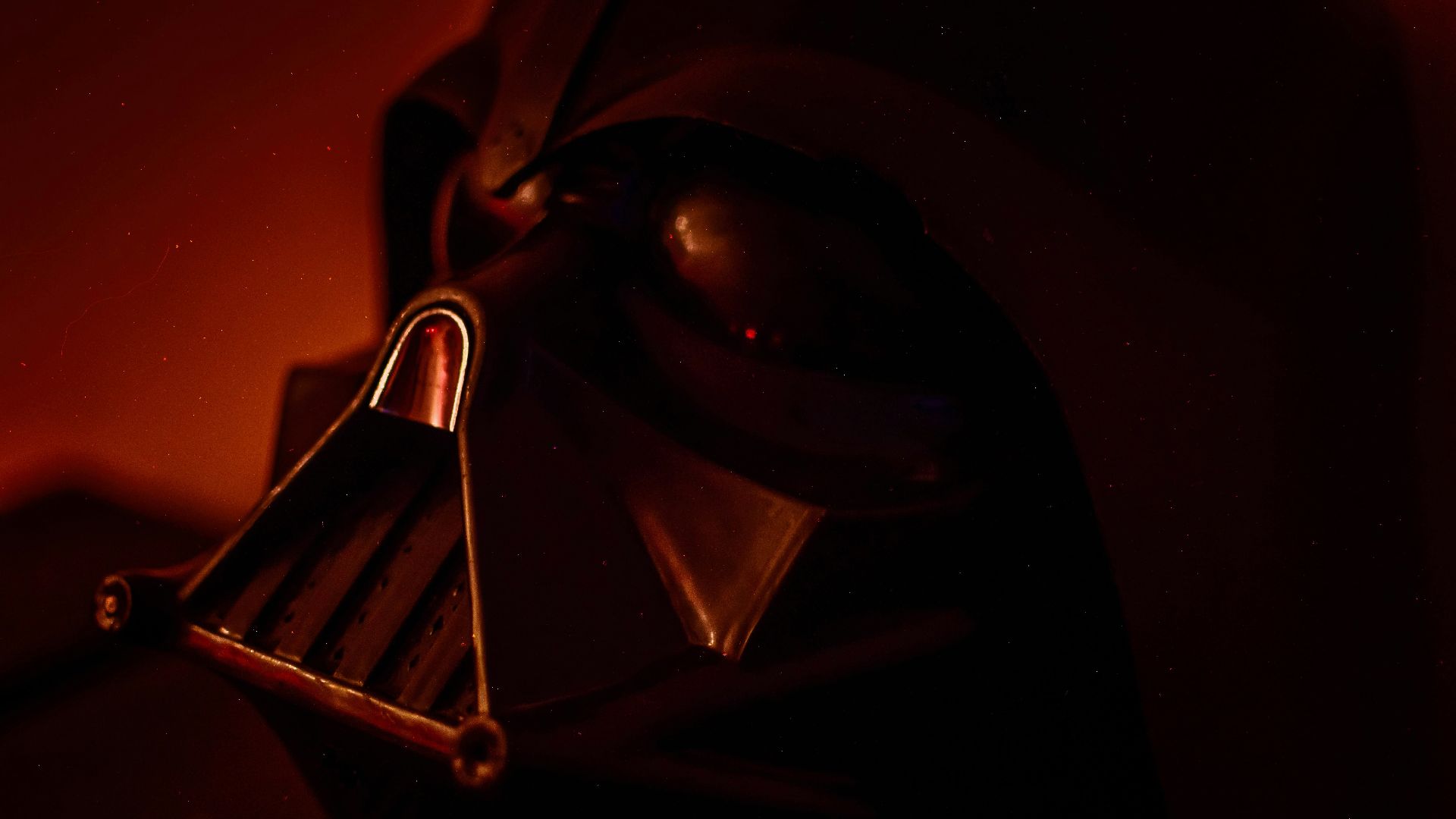 black and silver mask on black textile