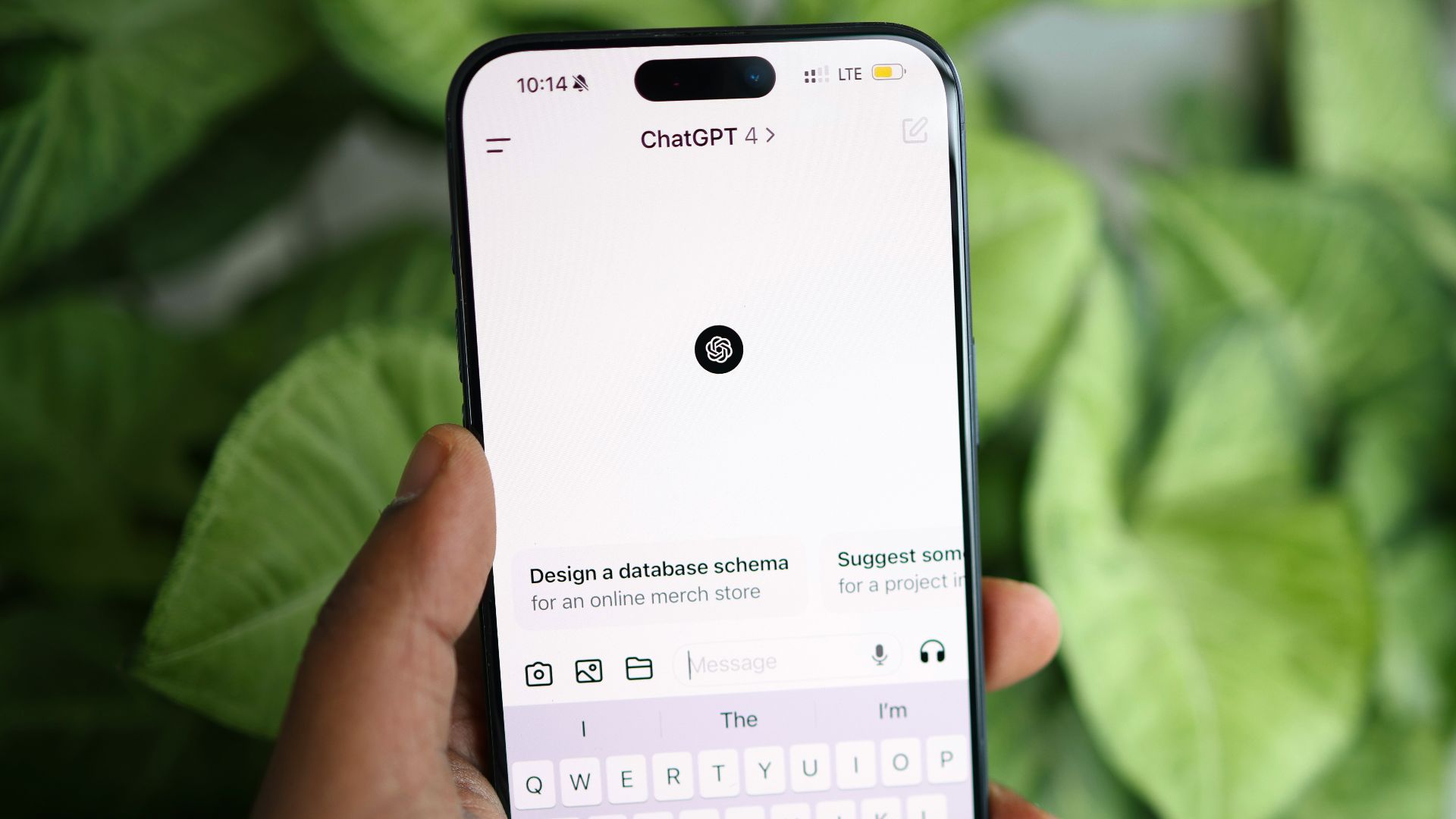 a person holding a cell phone in their hand