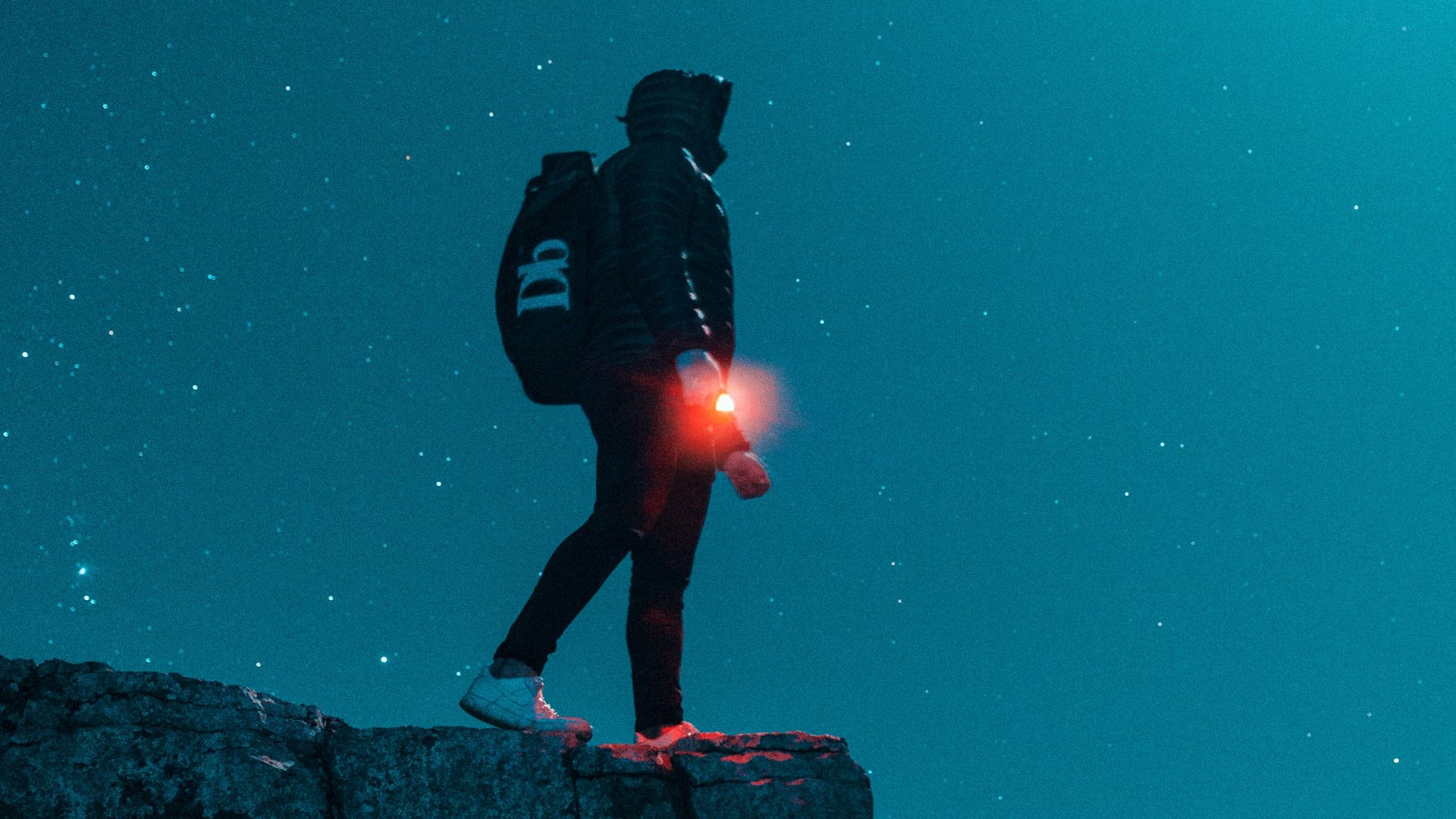man standing on cliff