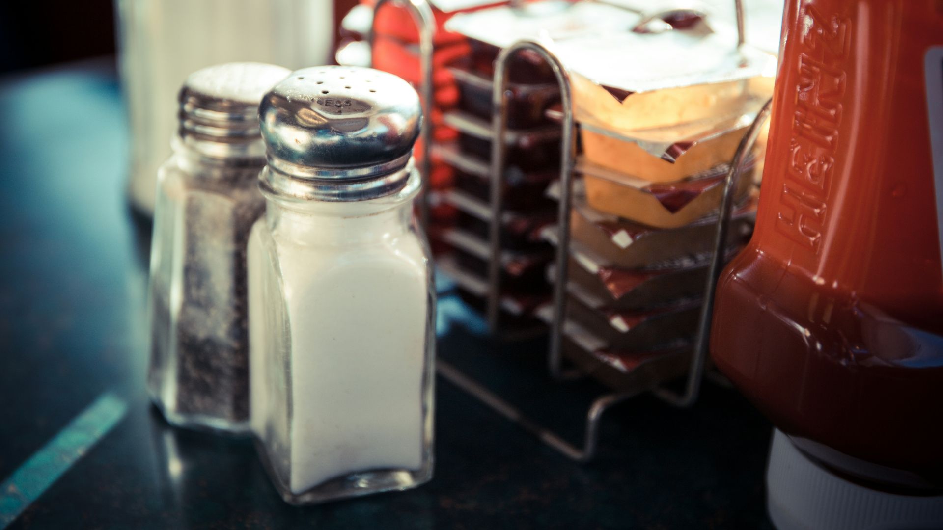 two salt and pepper shakers on a table
