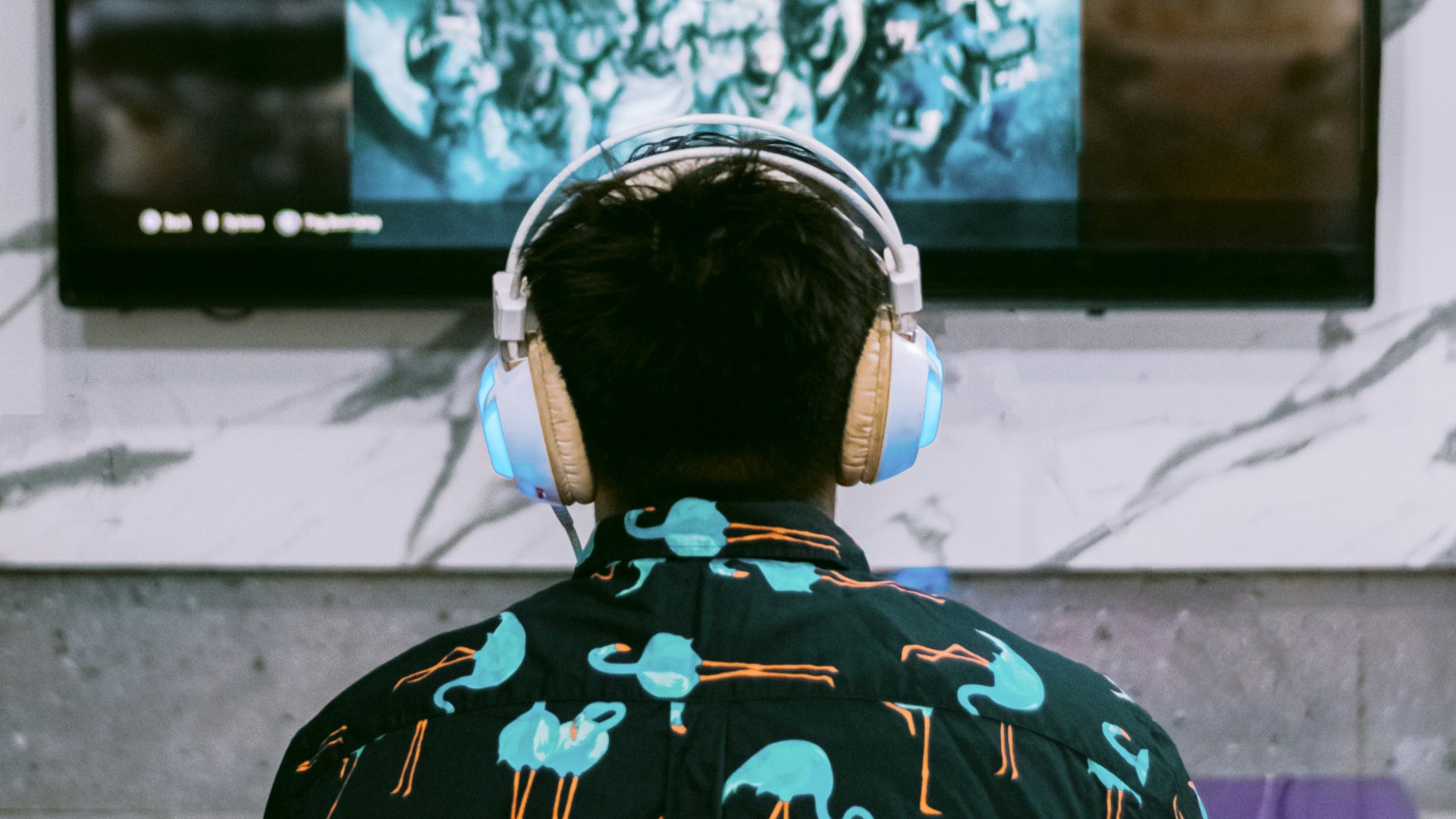 woman in black and white floral shirt standing in front of black and white wall