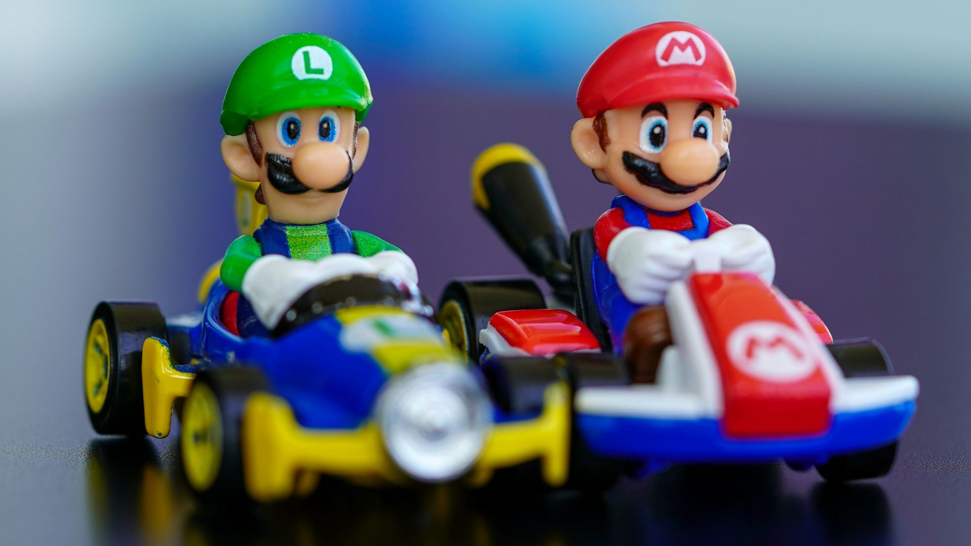 lego mini figure riding blue and red toy car