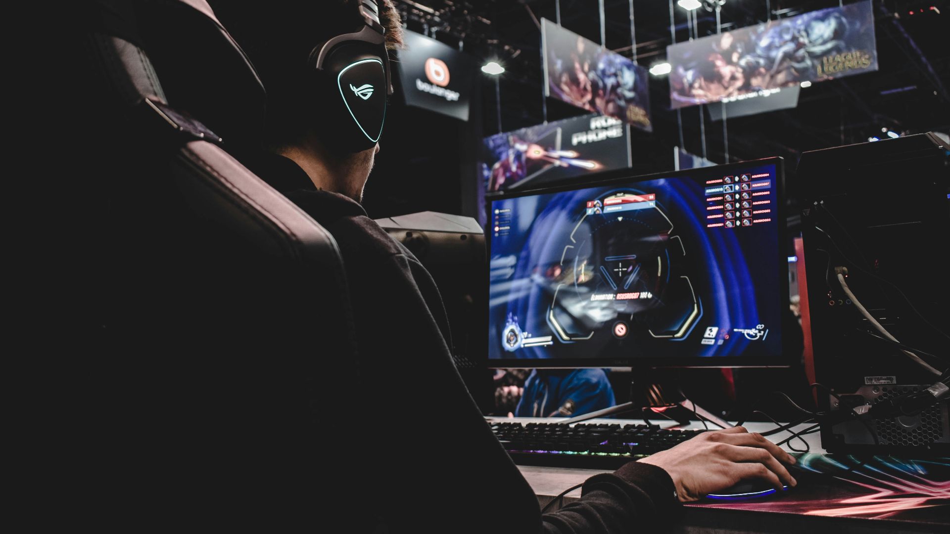 person sitting on gaming chair while playing video game