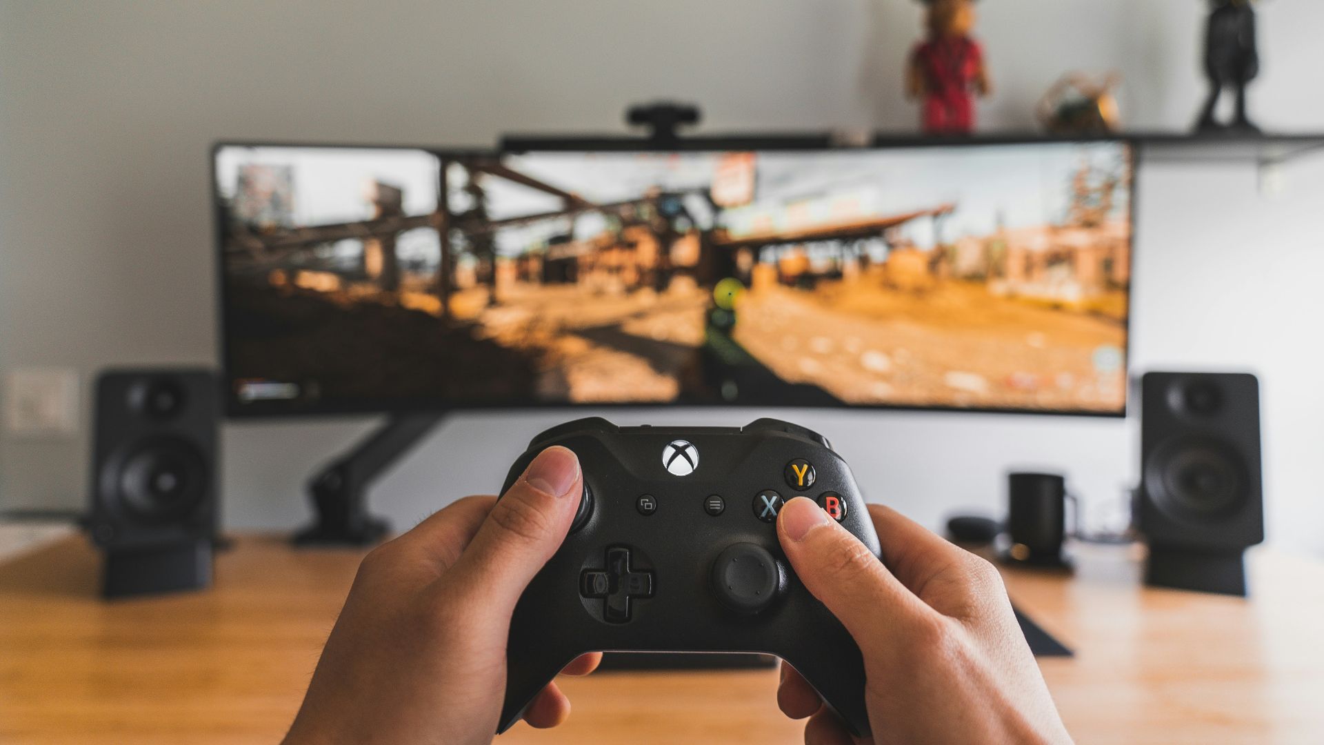 person holding black game controller