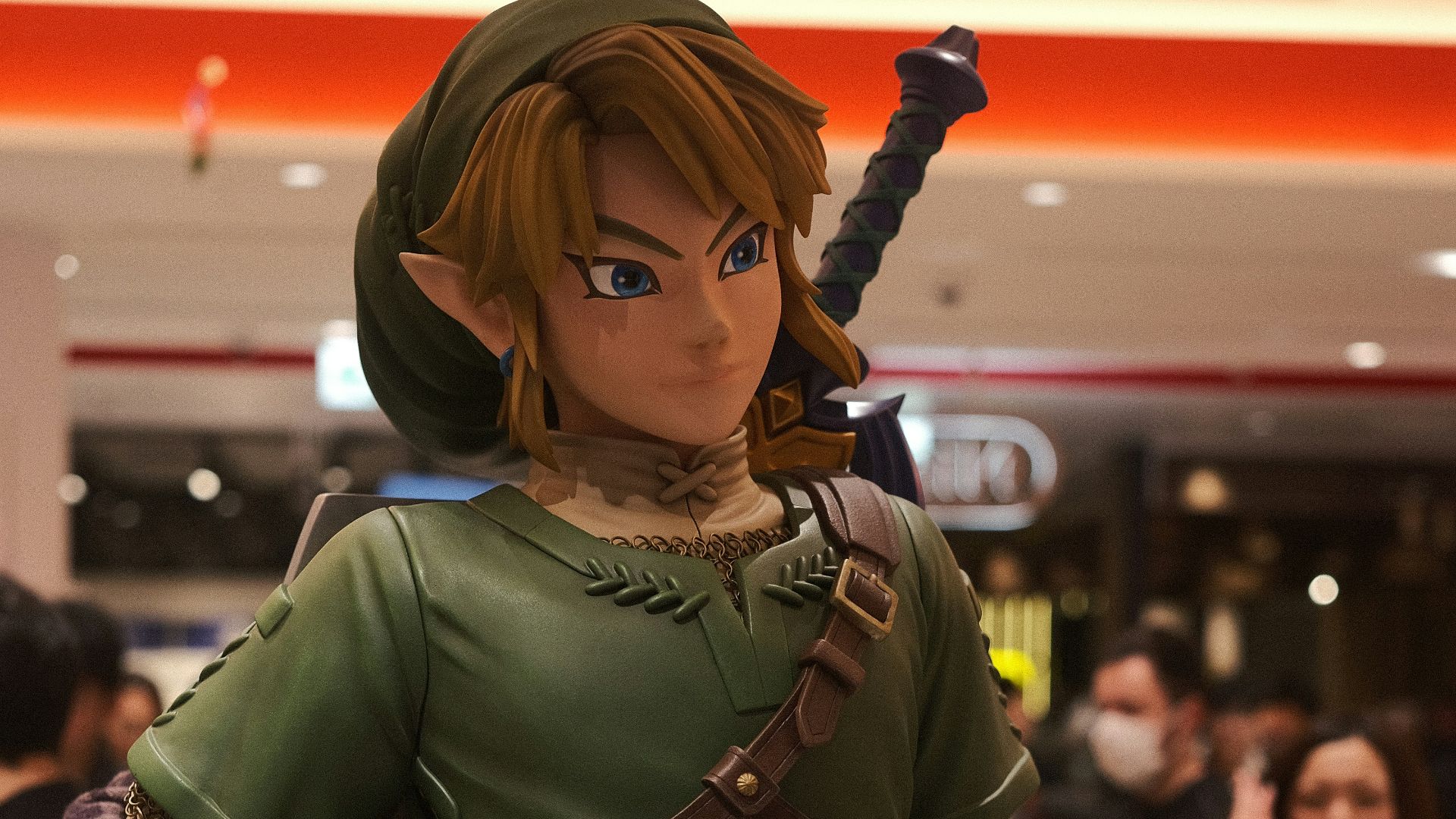 a statue of a woman in a green outfit