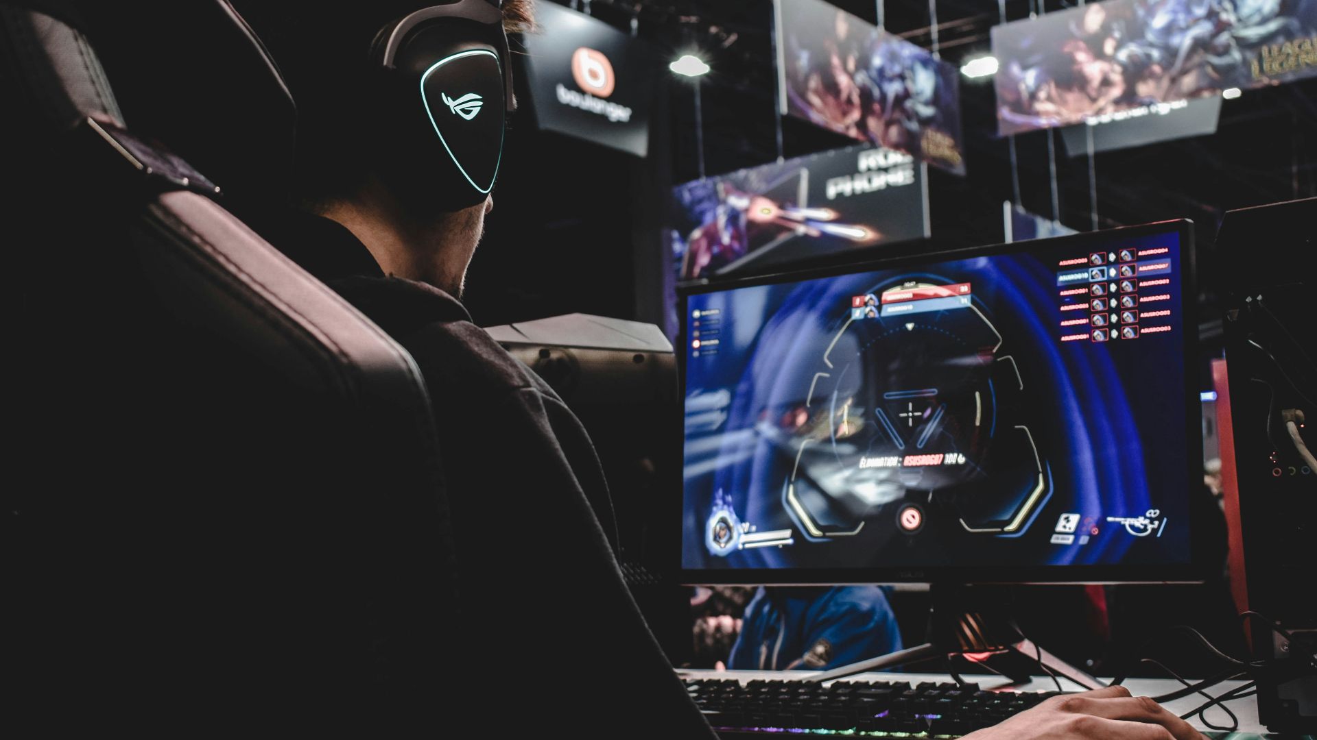 person sitting on gaming chair while playing video game